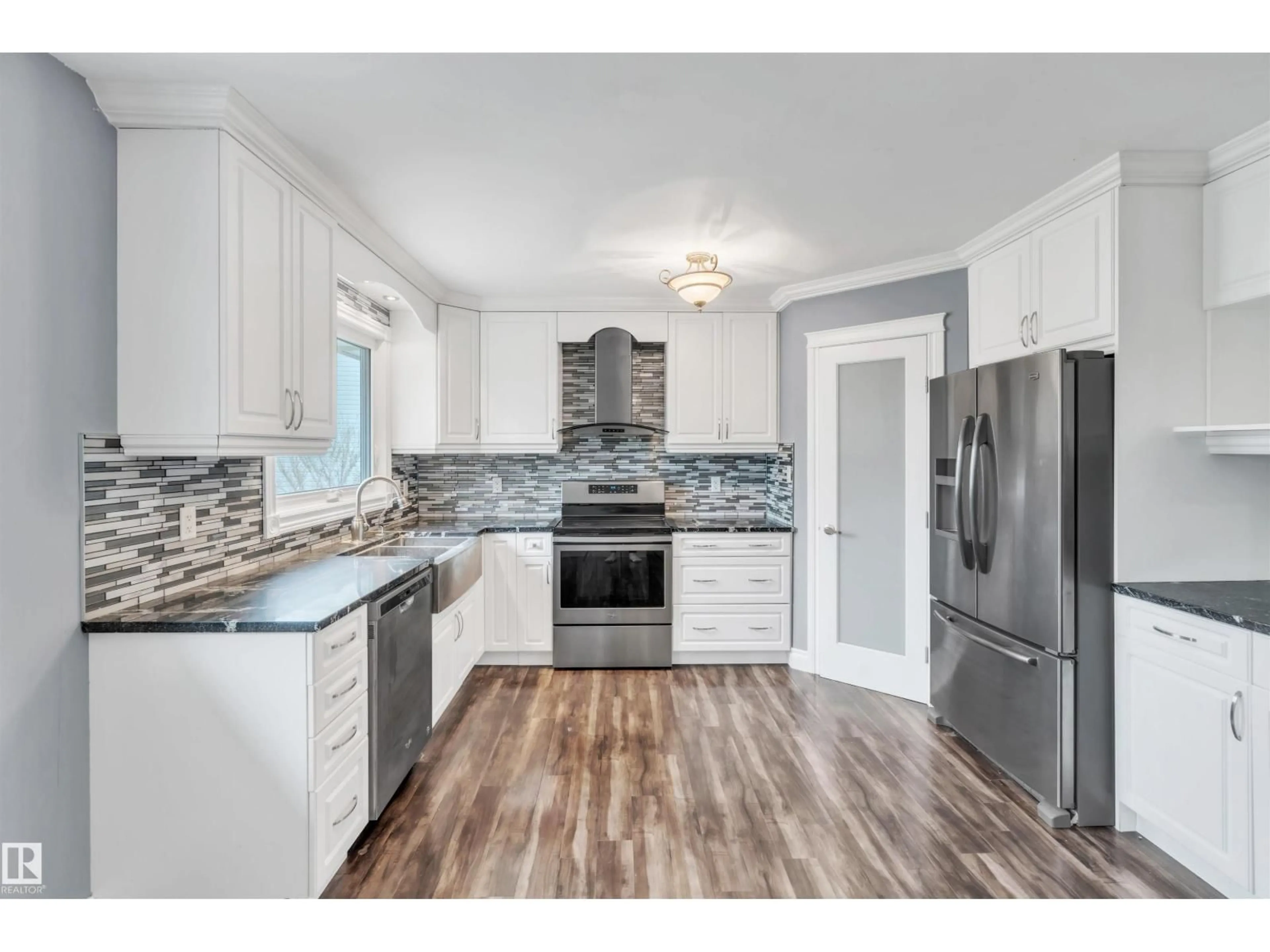 Open concept kitchen, wood/laminate floor for 405 - 61314 RR 463, Rural Bonnyville M.D. Alberta T9N2G9