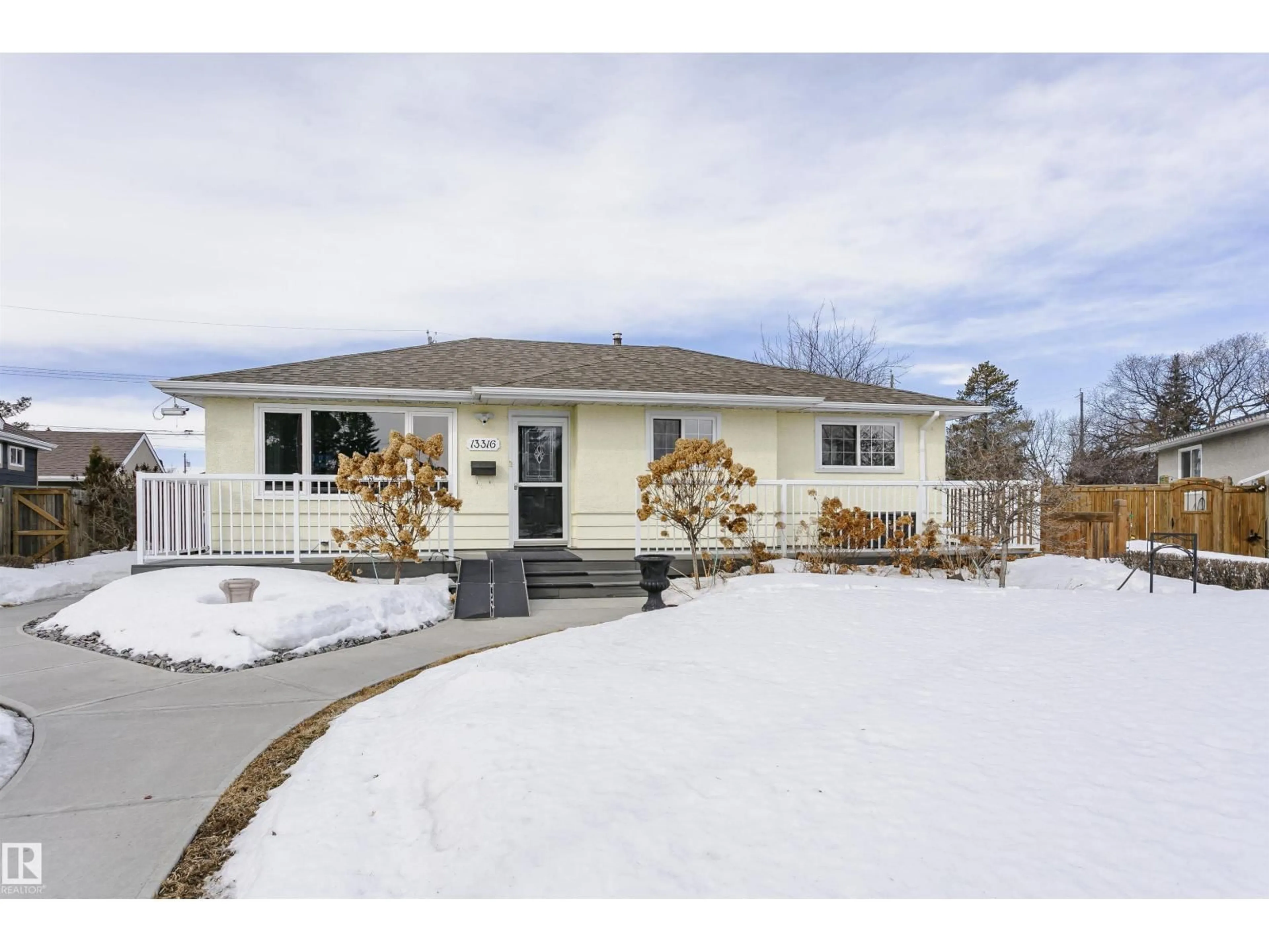 Home with vinyl exterior material, street for 13316 128 ST, Edmonton Alberta T5L1E8