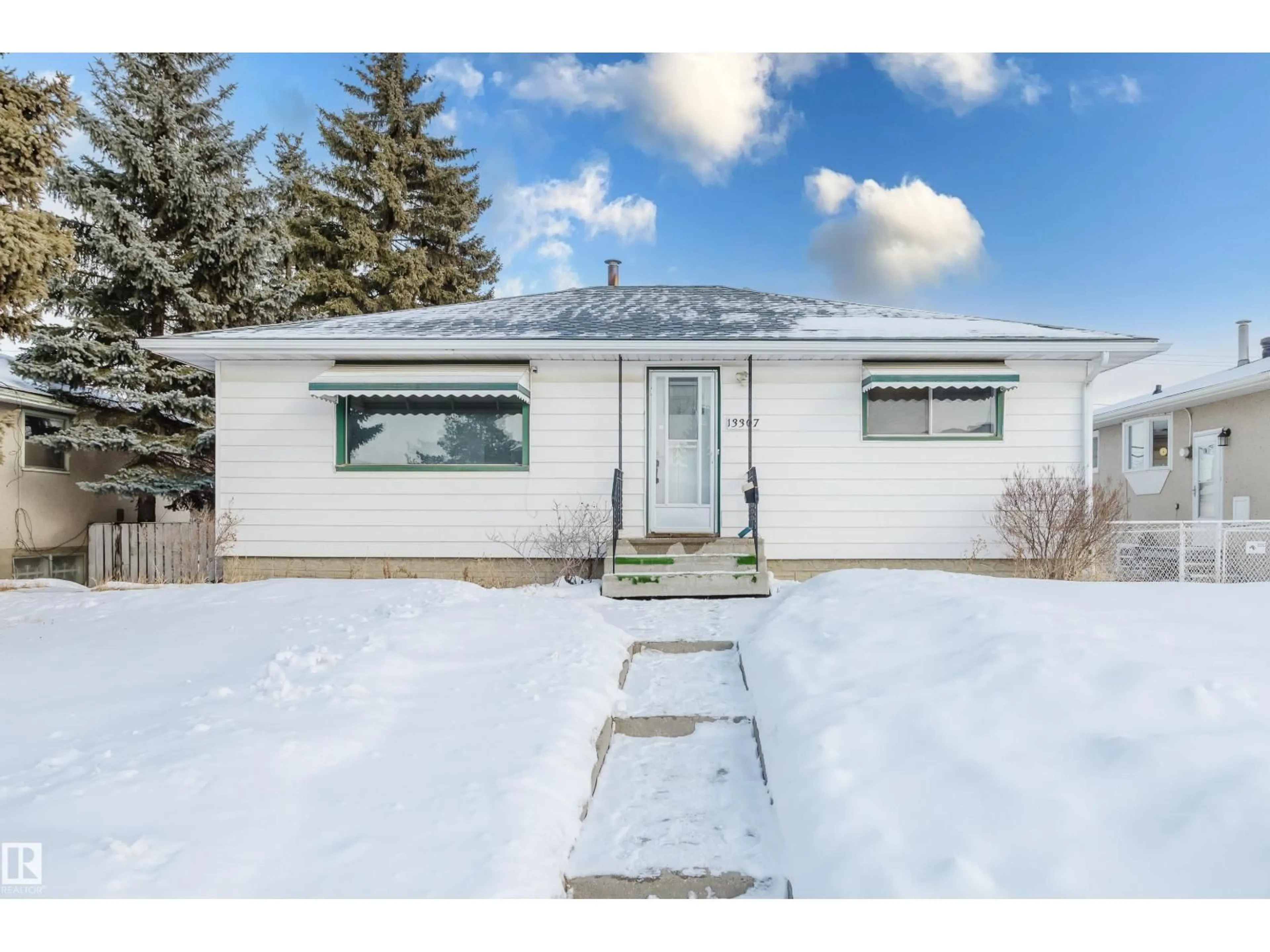 Home with vinyl exterior material, street for NW - 13307 124 ST, Edmonton Alberta T5L0R3