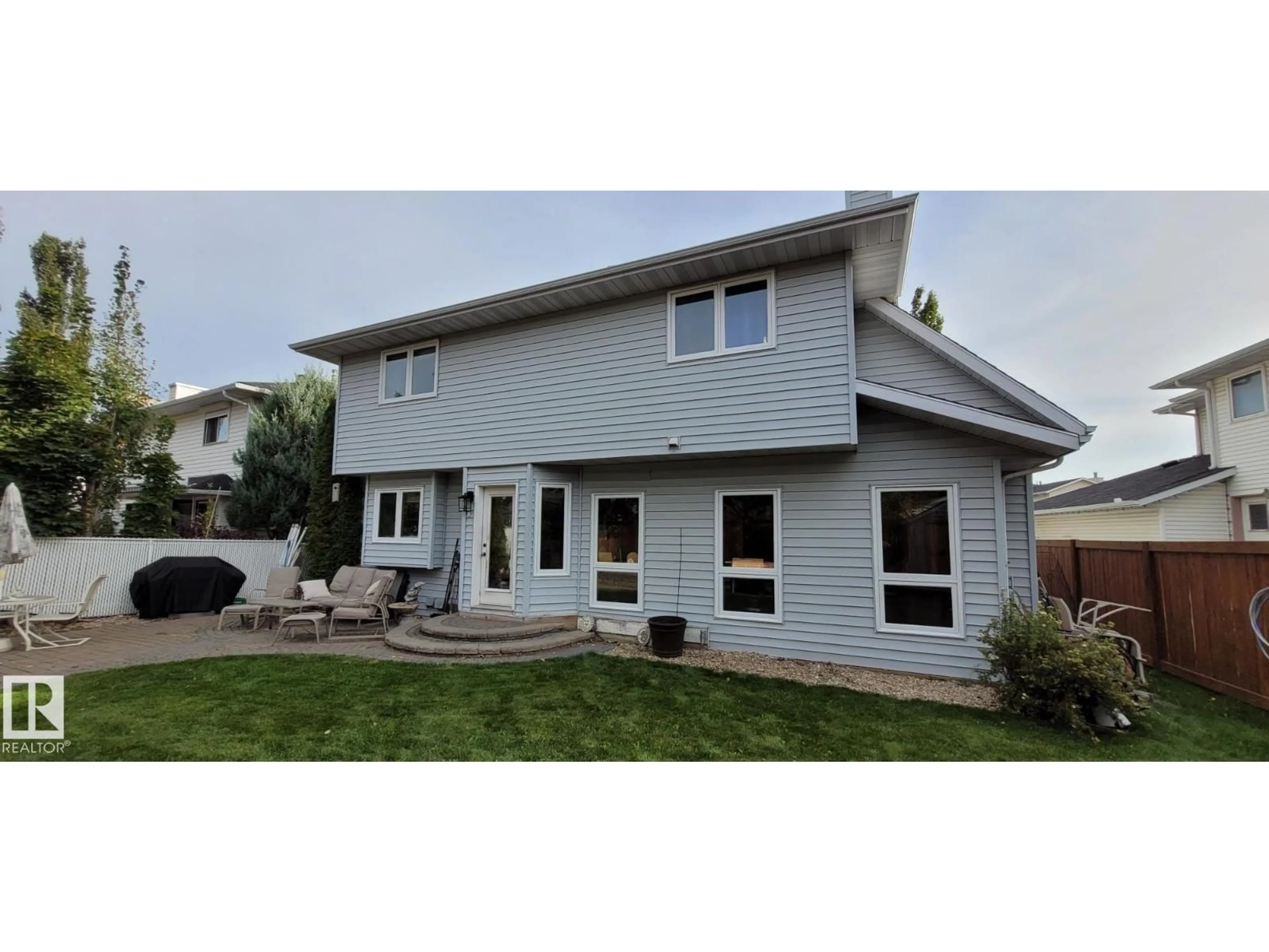 Home with vinyl exterior material, street for NW - 6018 156 AV, Edmonton Alberta T5Y2M8