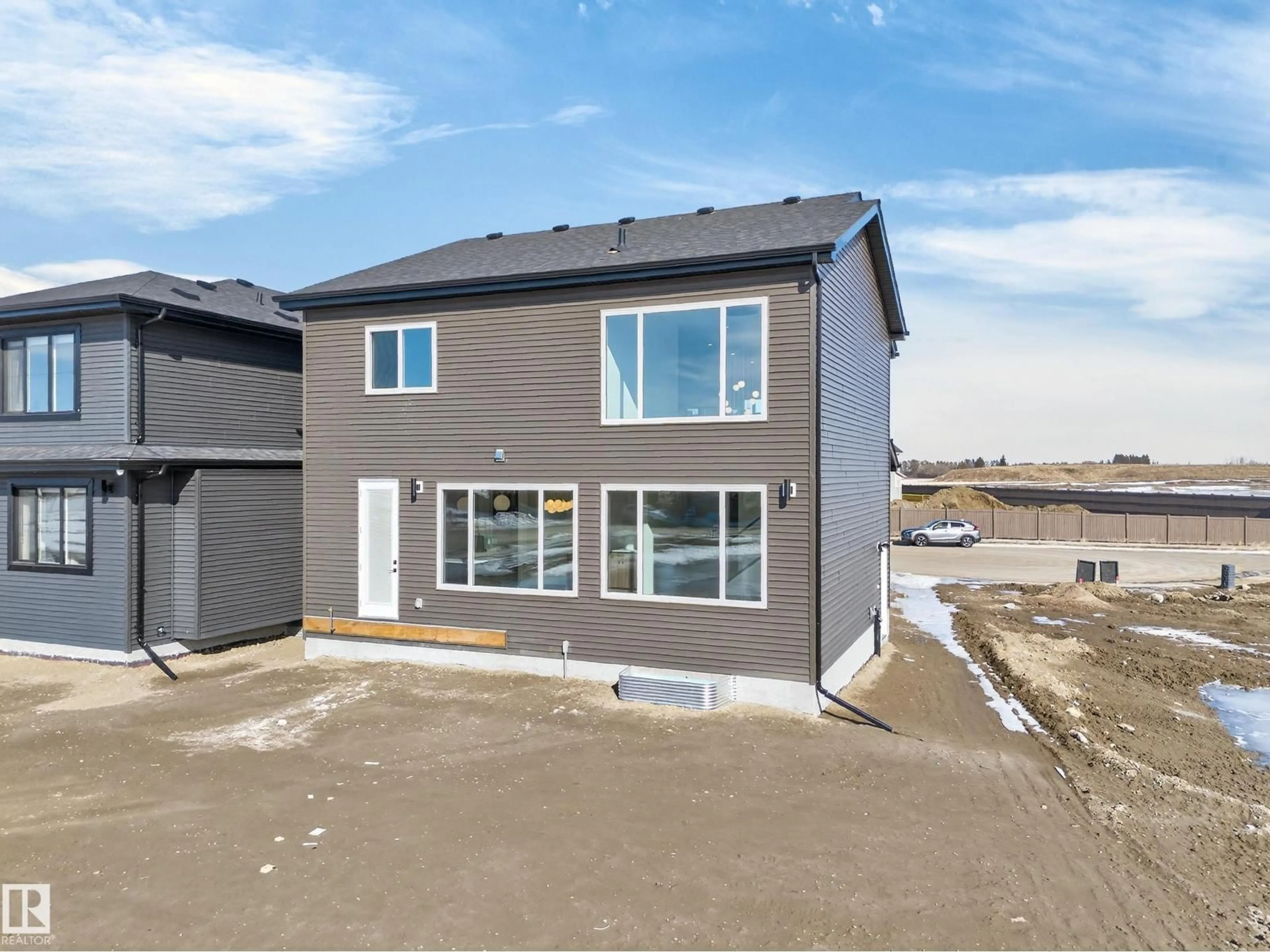 A pic from outside/outdoor area/front of a property/back of a property/a pic from drone, street for LI SW - 211 PATERSON LINK, Edmonton Alberta T6W5V3