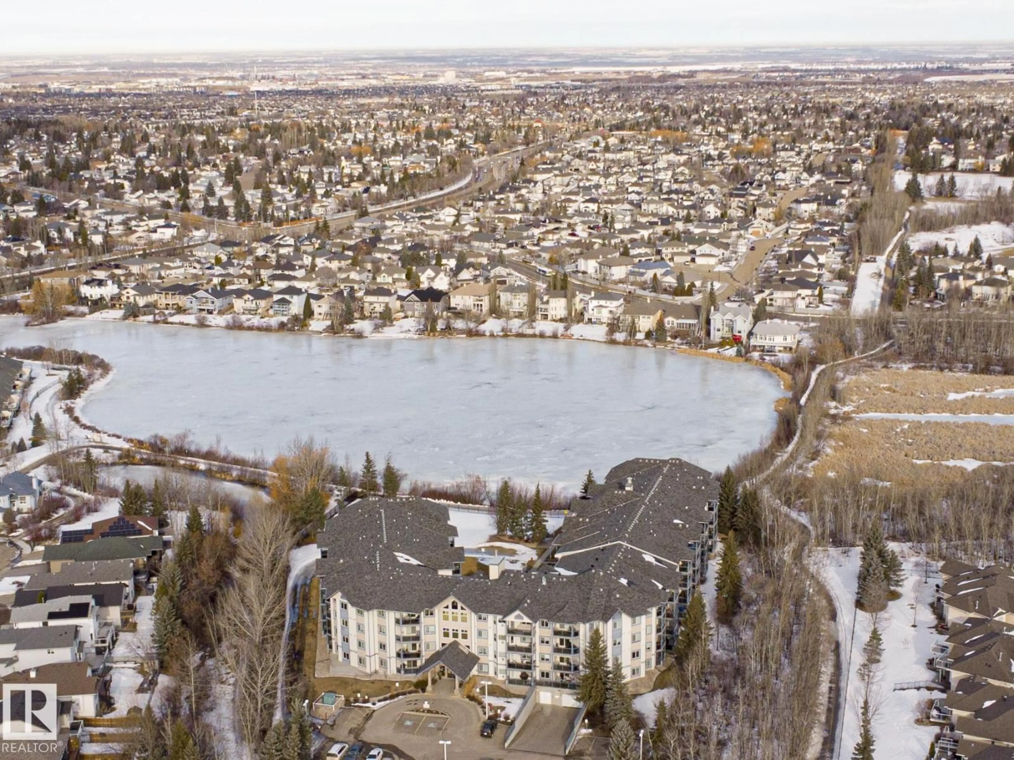 A pic from outside/outdoor area/front of a property/back of a property/a pic from drone, water/lake/river/ocean view for 100 - 314 FOXHAVEN DR, Sherwood Park Alberta T8A6B6
