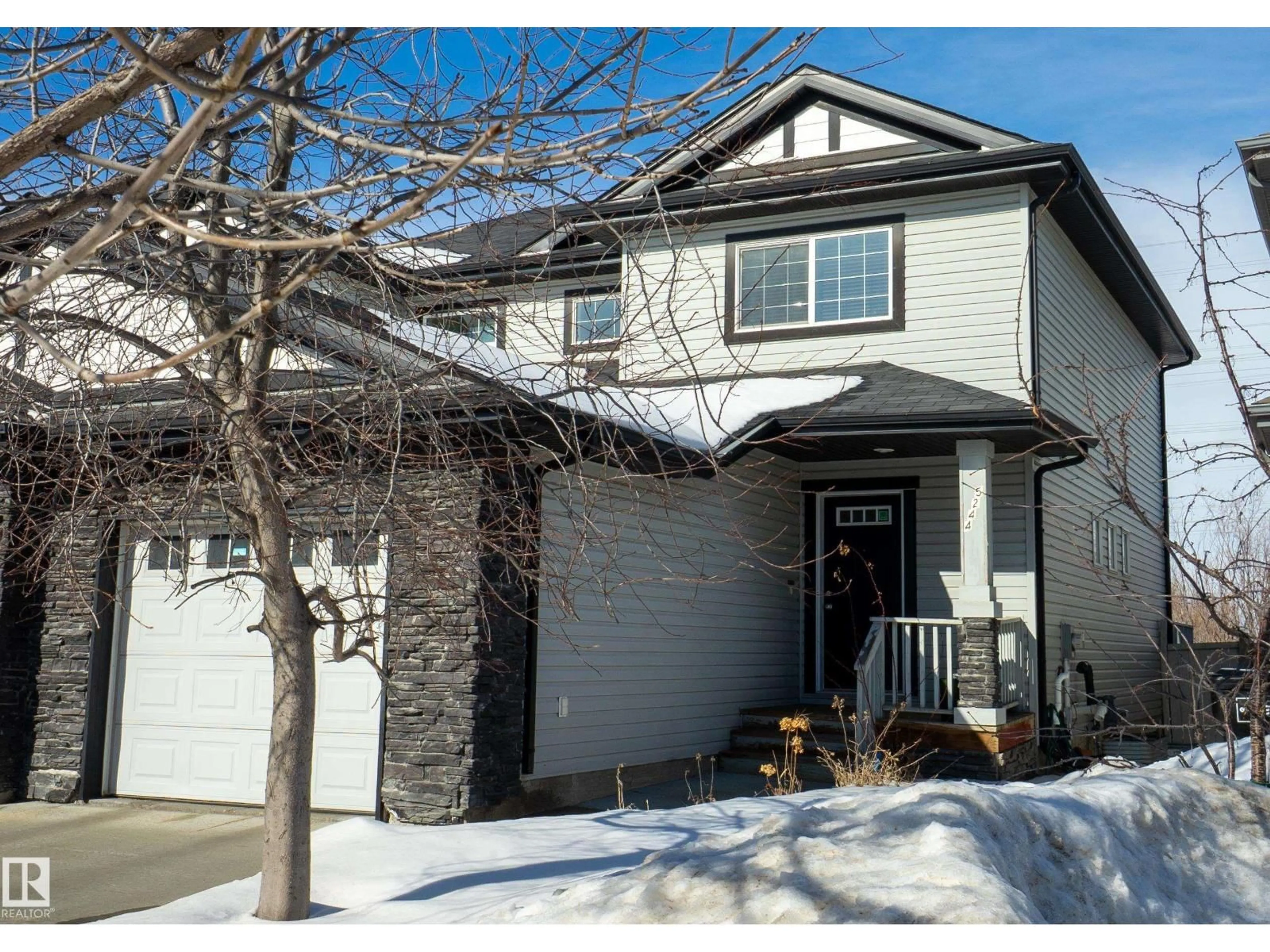 Home with vinyl exterior material, street for 5244 1A AV SW, Edmonton Alberta T6X0X1