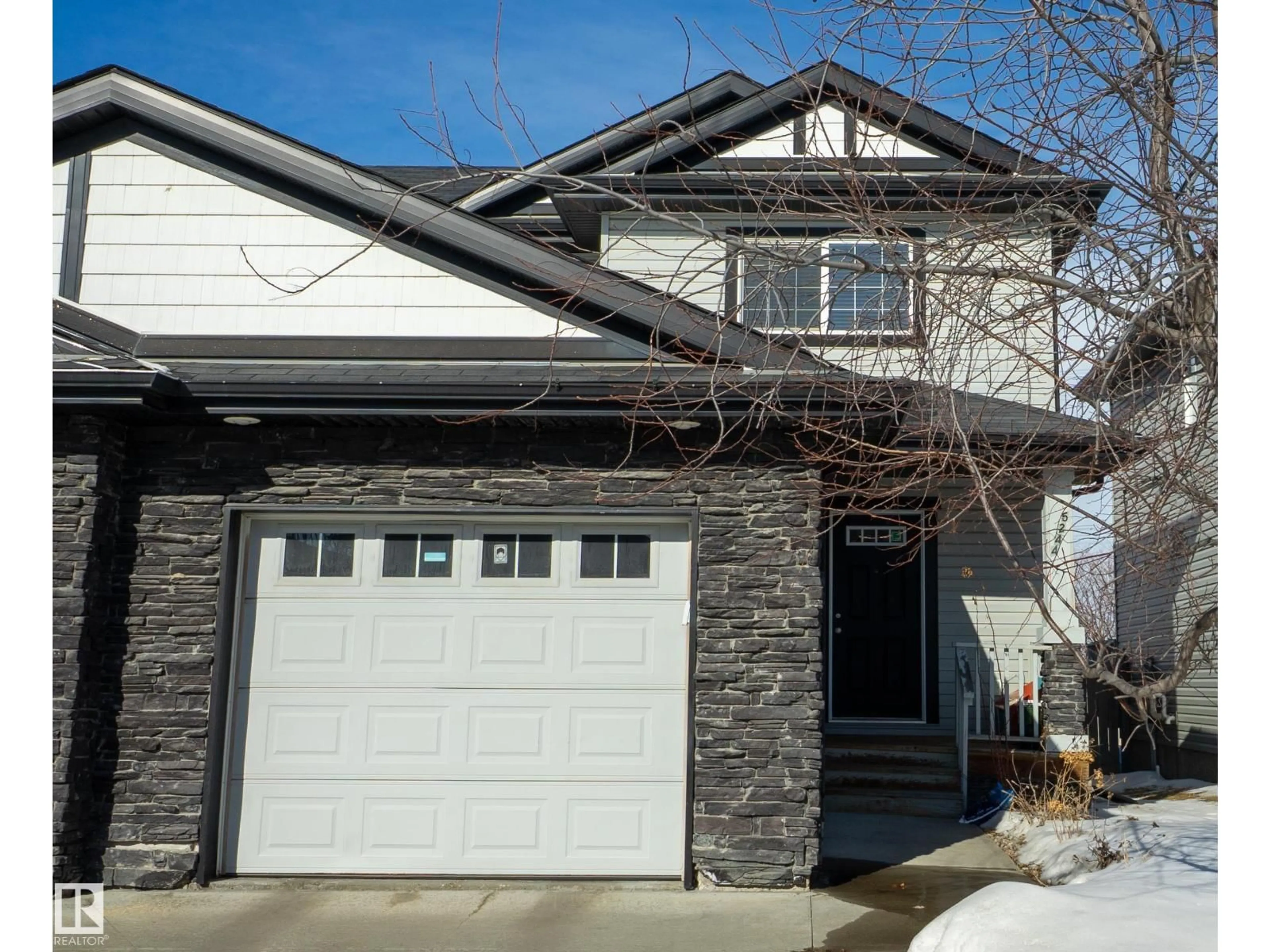 Home with vinyl exterior material, street for 5244 1A AV SW, Edmonton Alberta T6X0X1