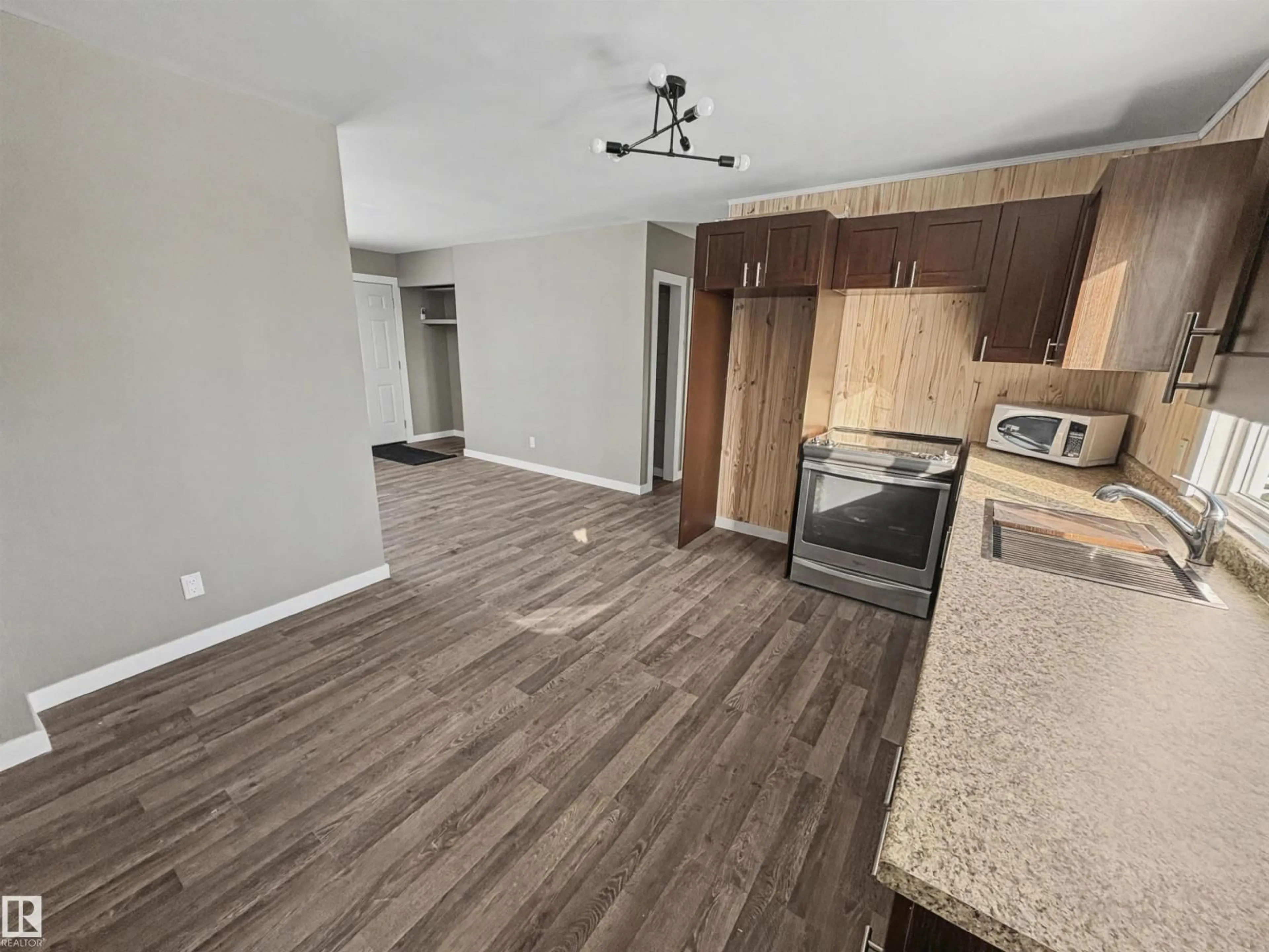Open concept kitchen, wood/laminate floor for 5010 48 AV, Fort Kent Alberta T0A1H0