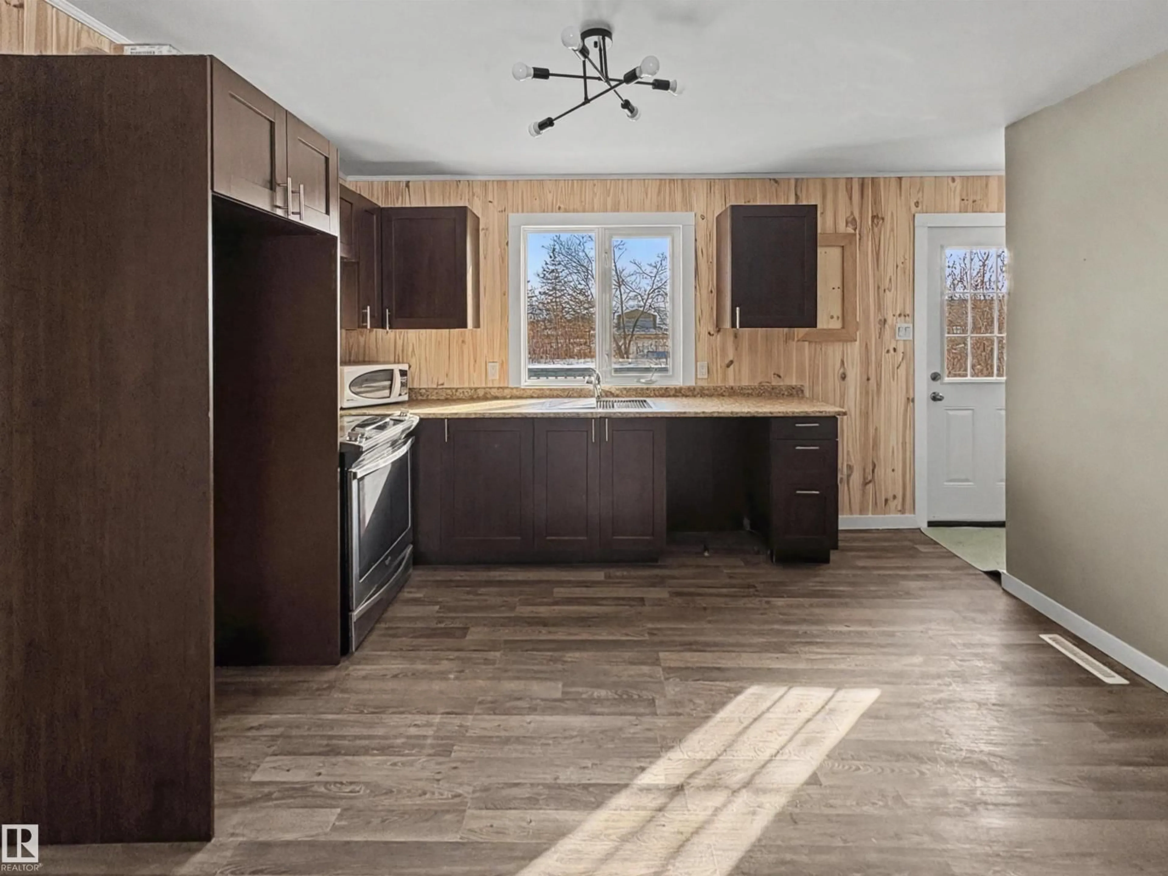 Open concept kitchen, wood/laminate floor for 5010 48 AV, Fort Kent Alberta T0A1H0