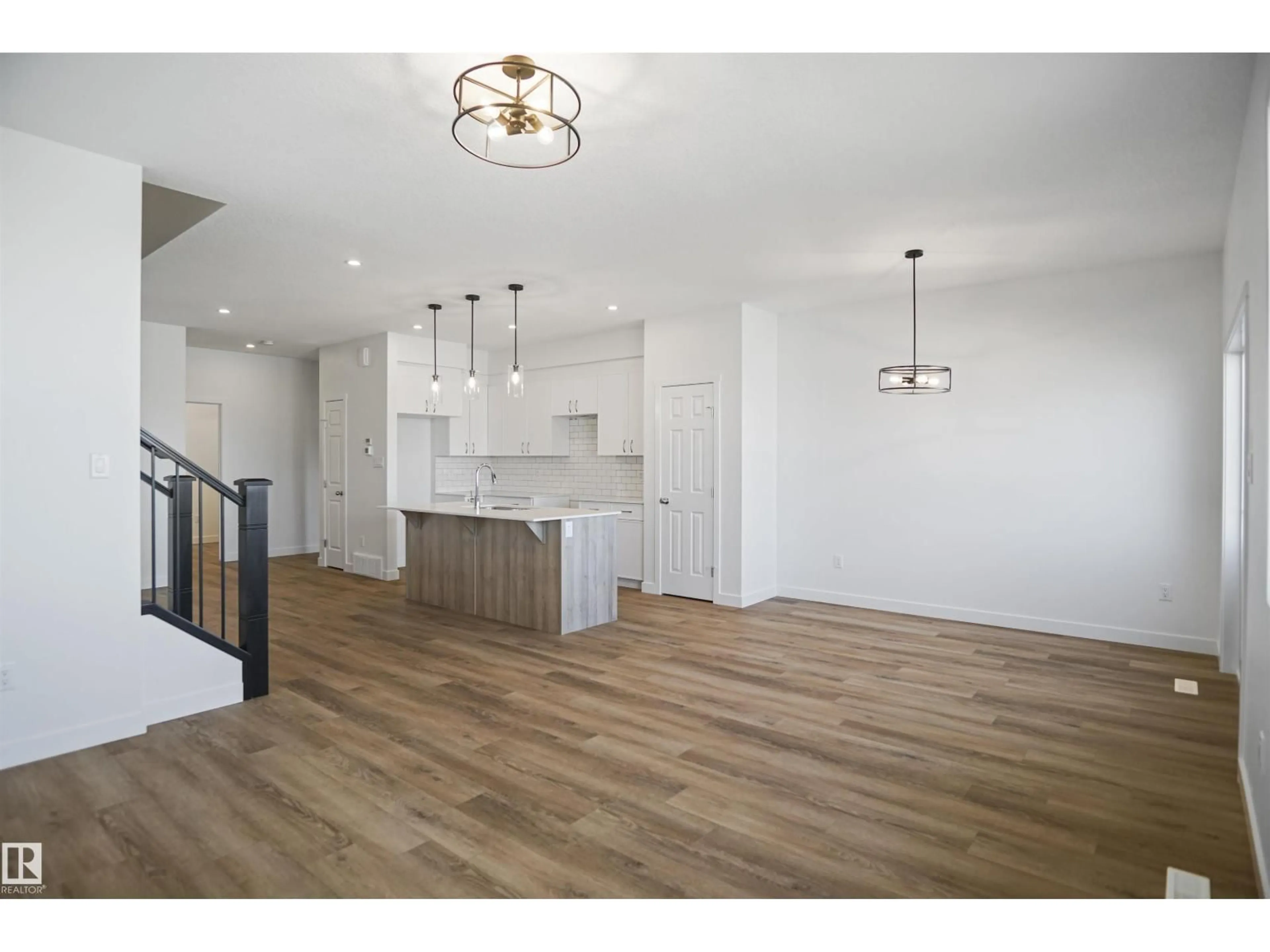 Open concept kitchen, wood/laminate floor for 18963 28 AV, Edmonton Alberta T6M1P7