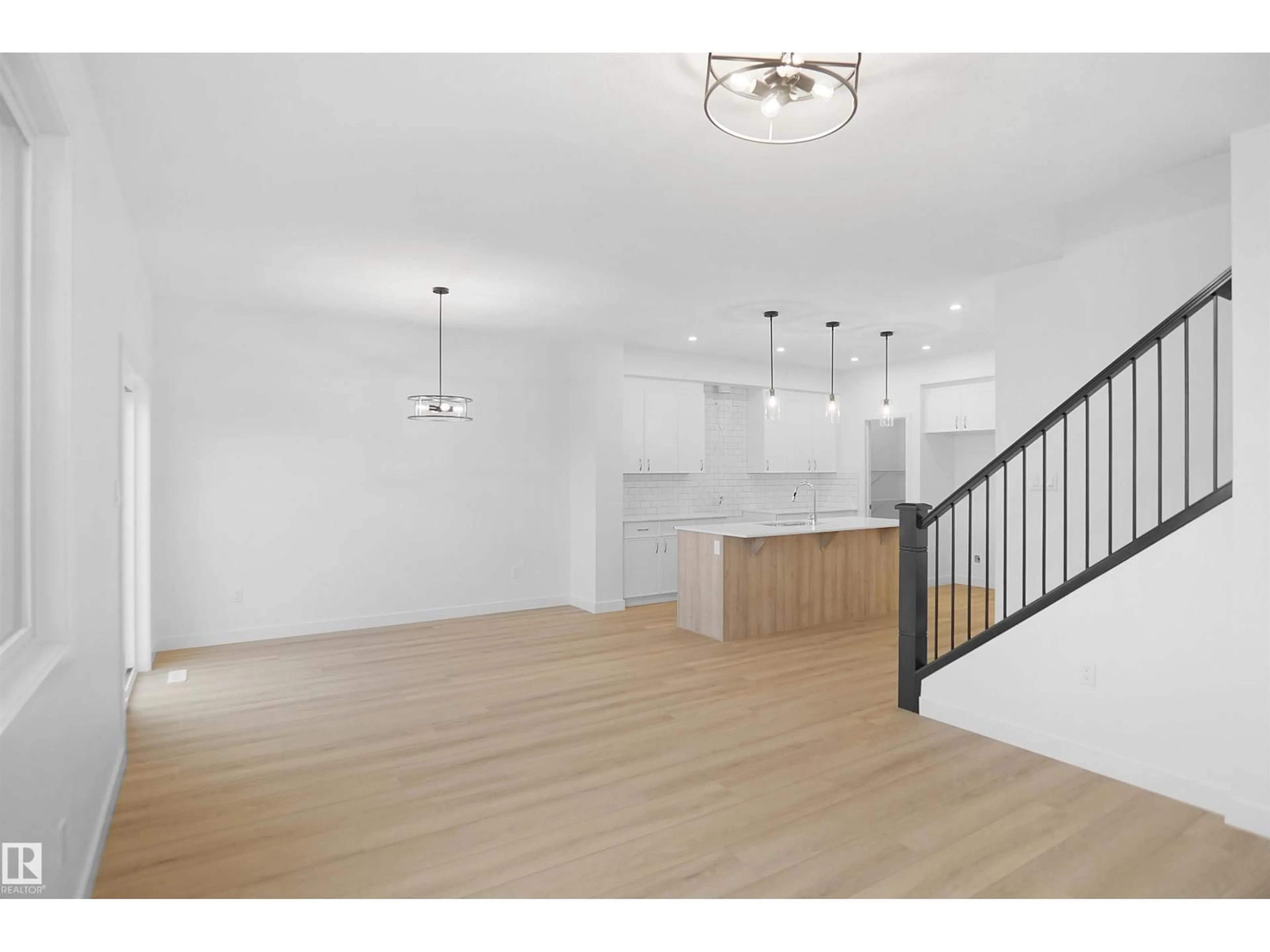 Open concept kitchen, wood/laminate floor for 7247 182 AV, Edmonton Alberta T5Z0L5