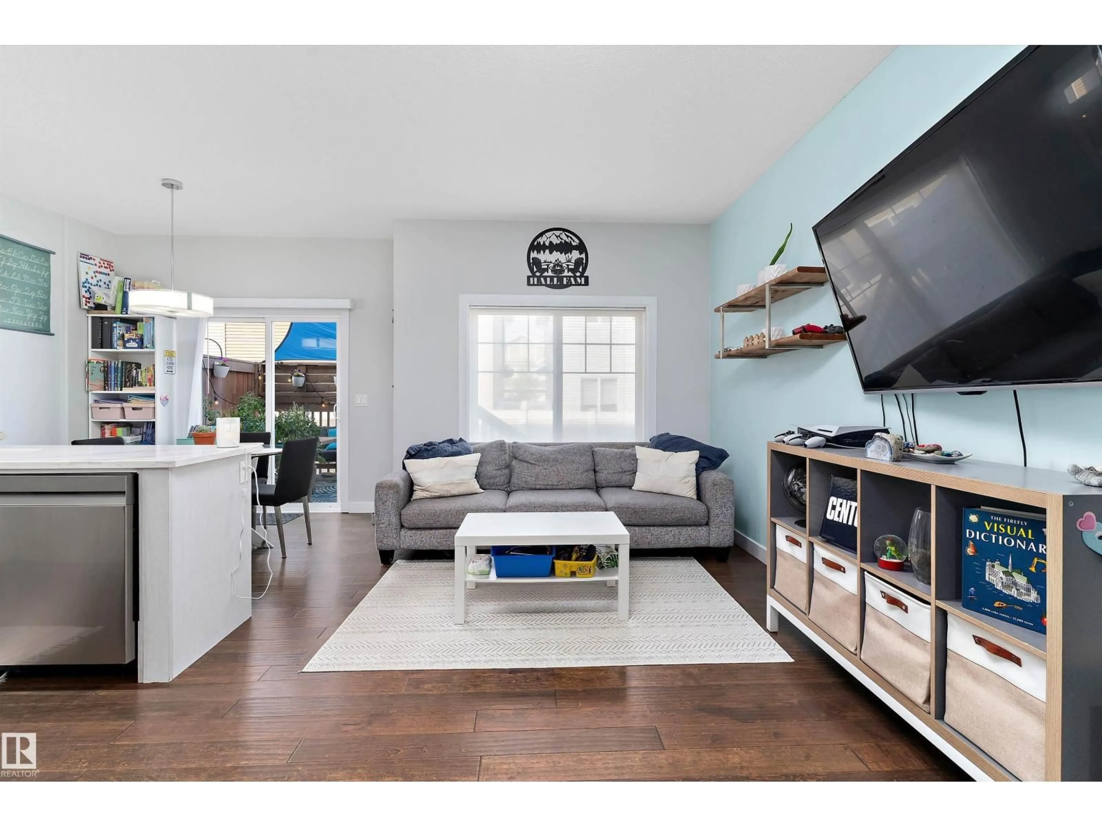 Living room with furniture, wood/laminate floor for 3304 66 ST, Beaumont Alberta T4X0W7