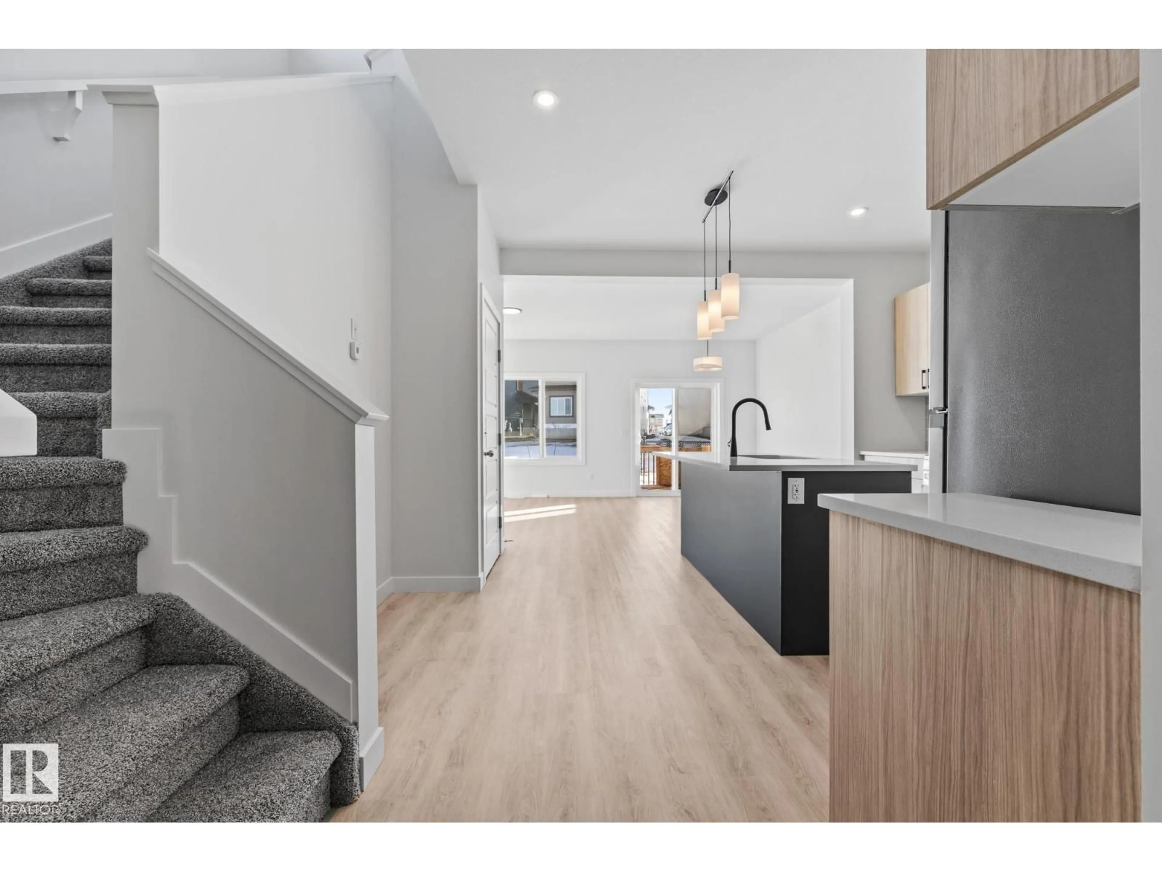 Open concept kitchen, wood/laminate floor for 144 HONEYSUCKLE GR, Leduc Alberta T9E0K1