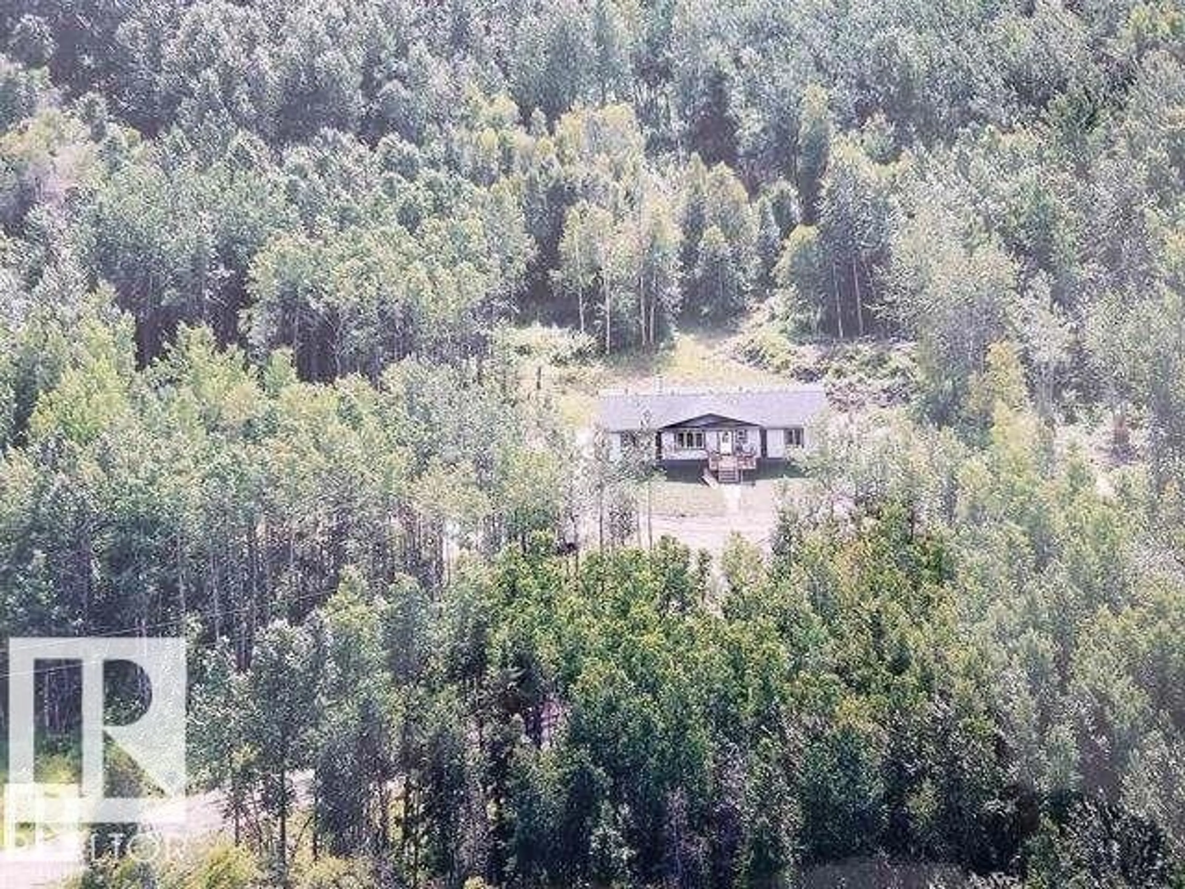 A pic from outside/outdoor area/front of a property/back of a property/a pic from drone, forest/trees view for 53508 RGE ROAD 35, Rural Lac Ste. Anne County Alberta T0E1N0