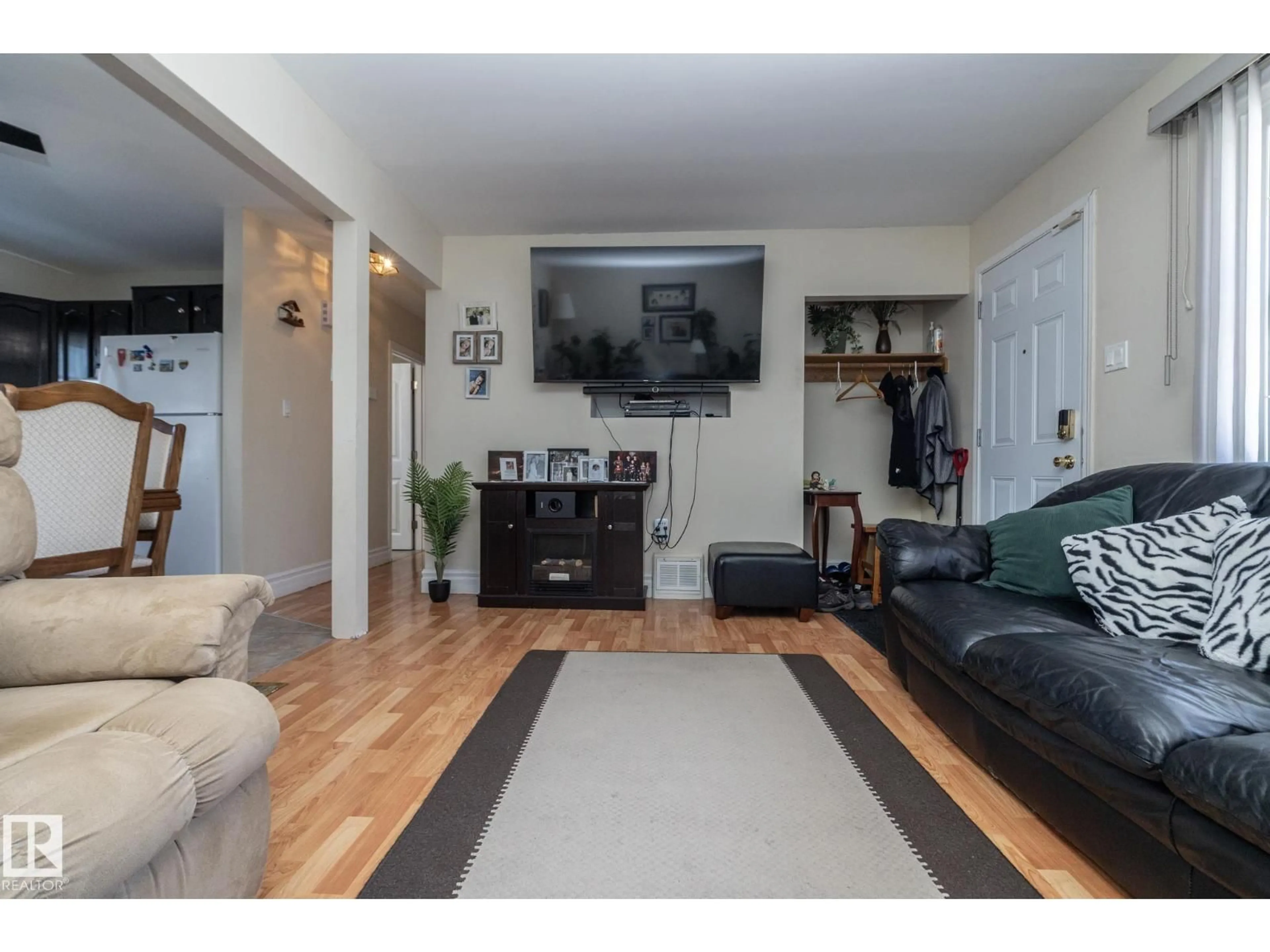Living room with furniture, wood/laminate floor for NW - 9702 163 ST, Edmonton Alberta T5P3M8