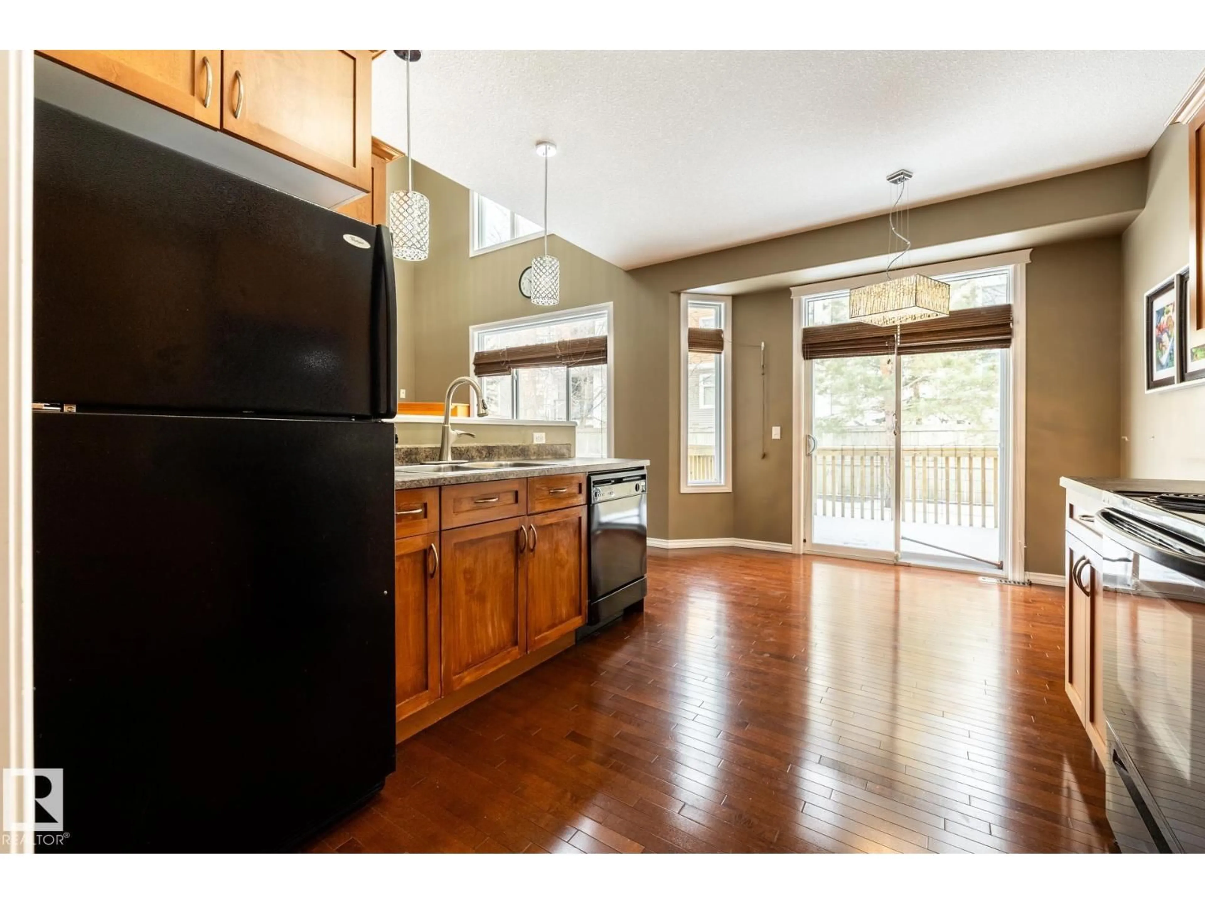 Open concept kitchen, wood/laminate floor for 11622 11 AV, Edmonton Alberta T6W1W8