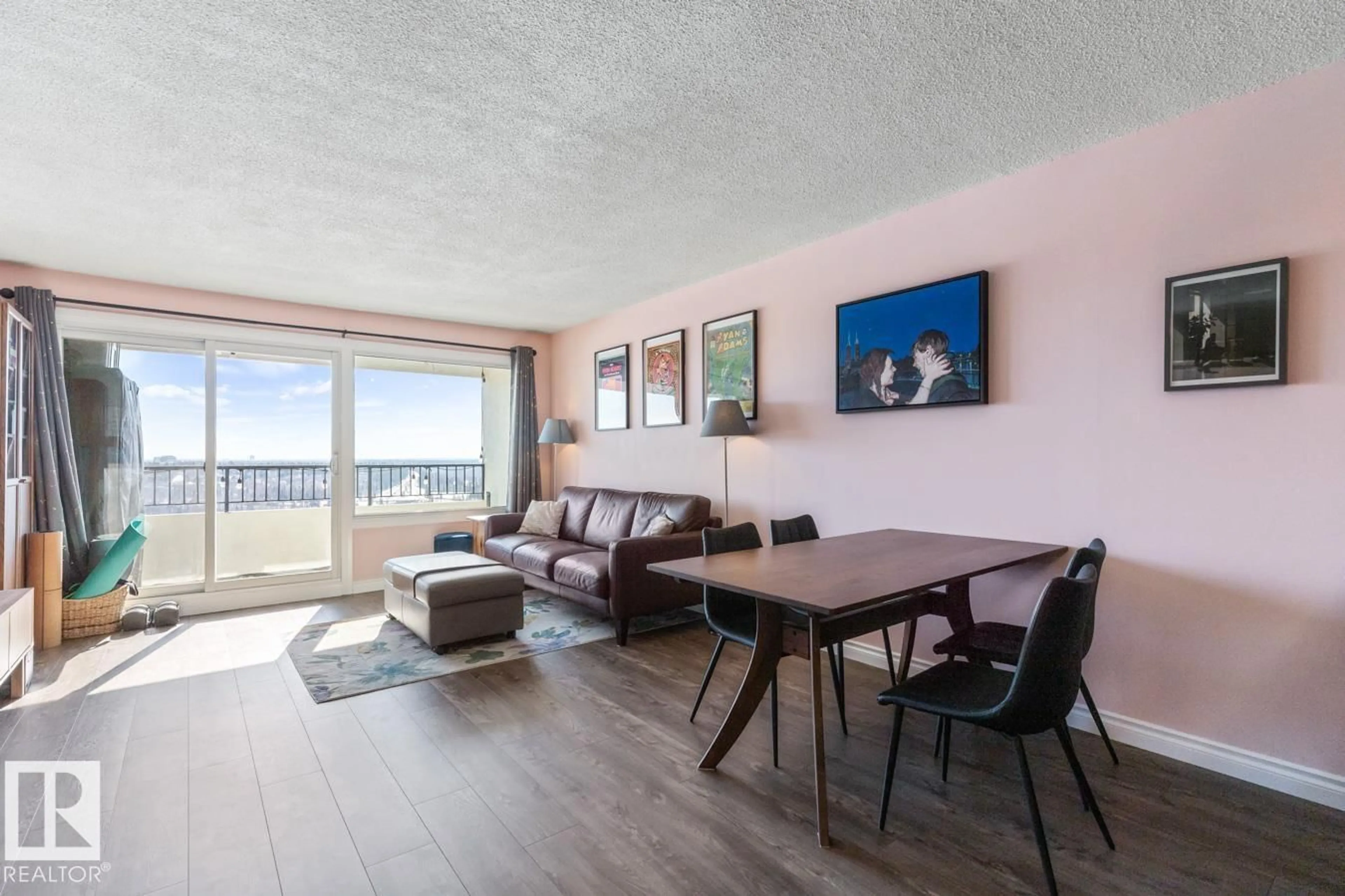 Living room with furniture, wood/laminate floor for 1207 JASPER AV, Edmonton Alberta T5N3K7