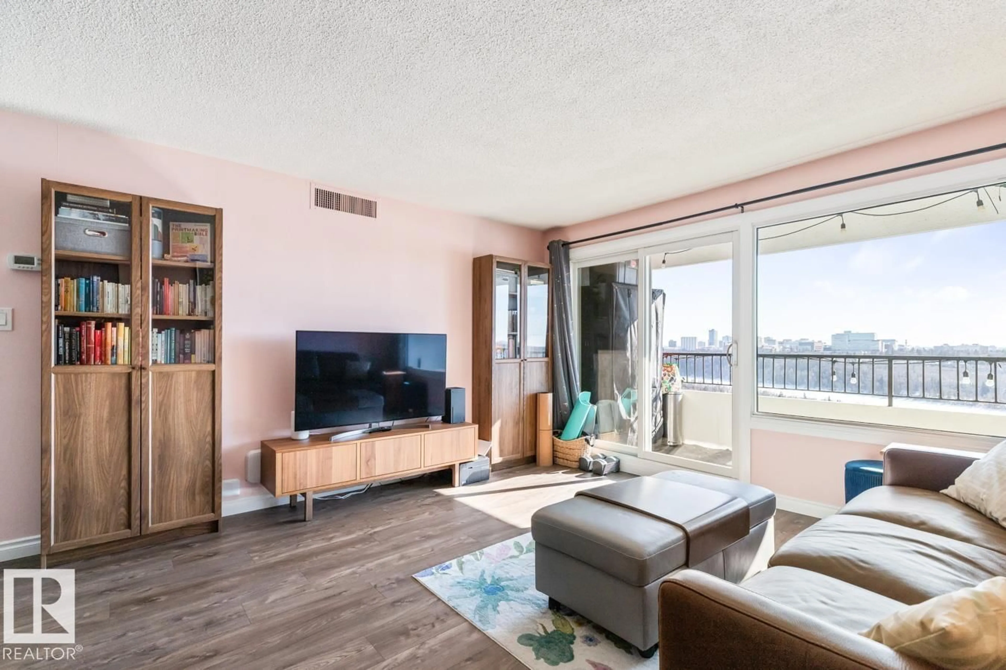 Living room with furniture, wood/laminate floor for 1207 JASPER AV, Edmonton Alberta T5N3K7