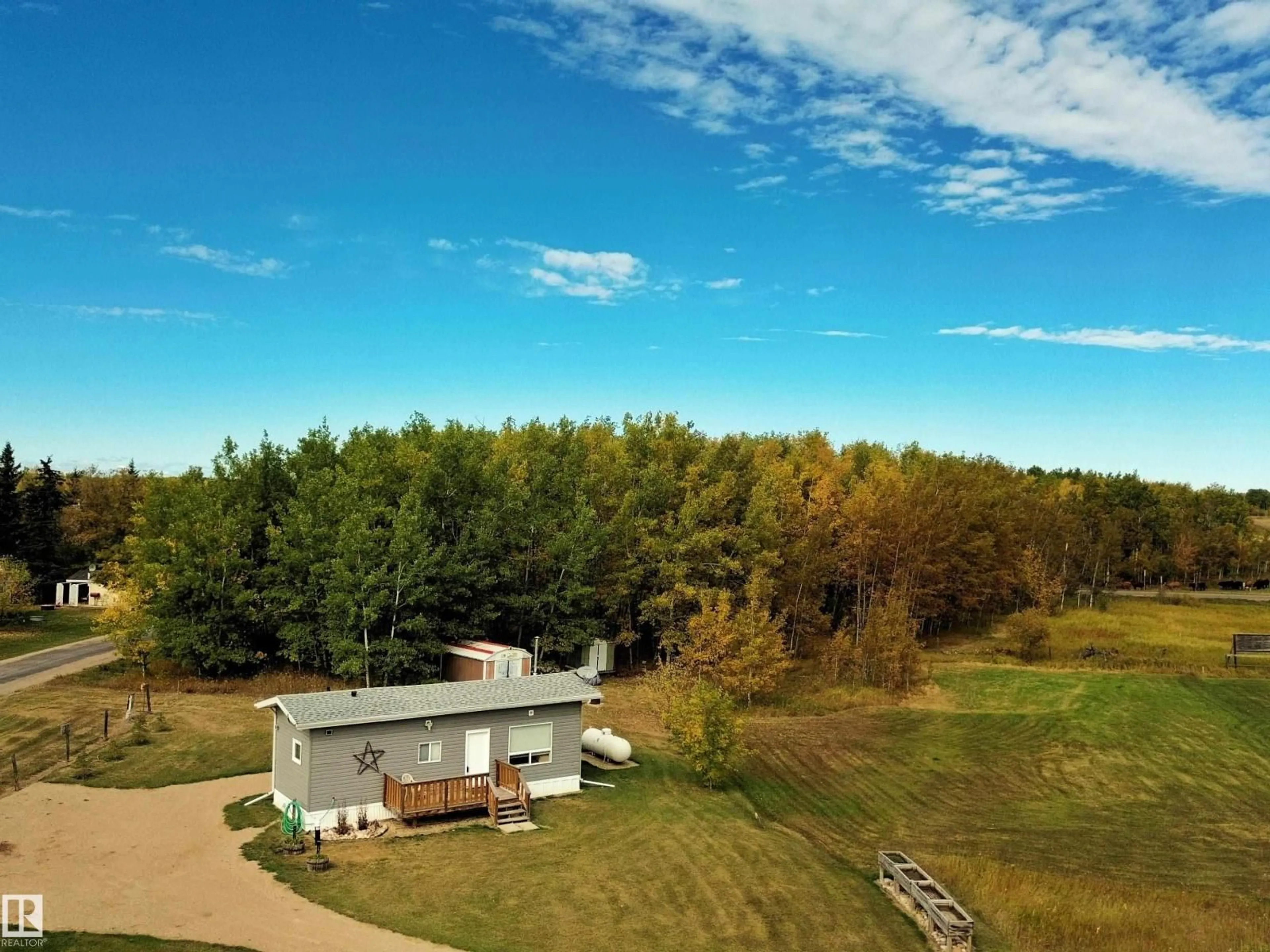 A pic from outside/outdoor area/front of a property/back of a property/a pic from drone, forest/trees view for 106 - 57730 RANGE ROAD 30, Rural Barrhead County Alberta T0G0H0