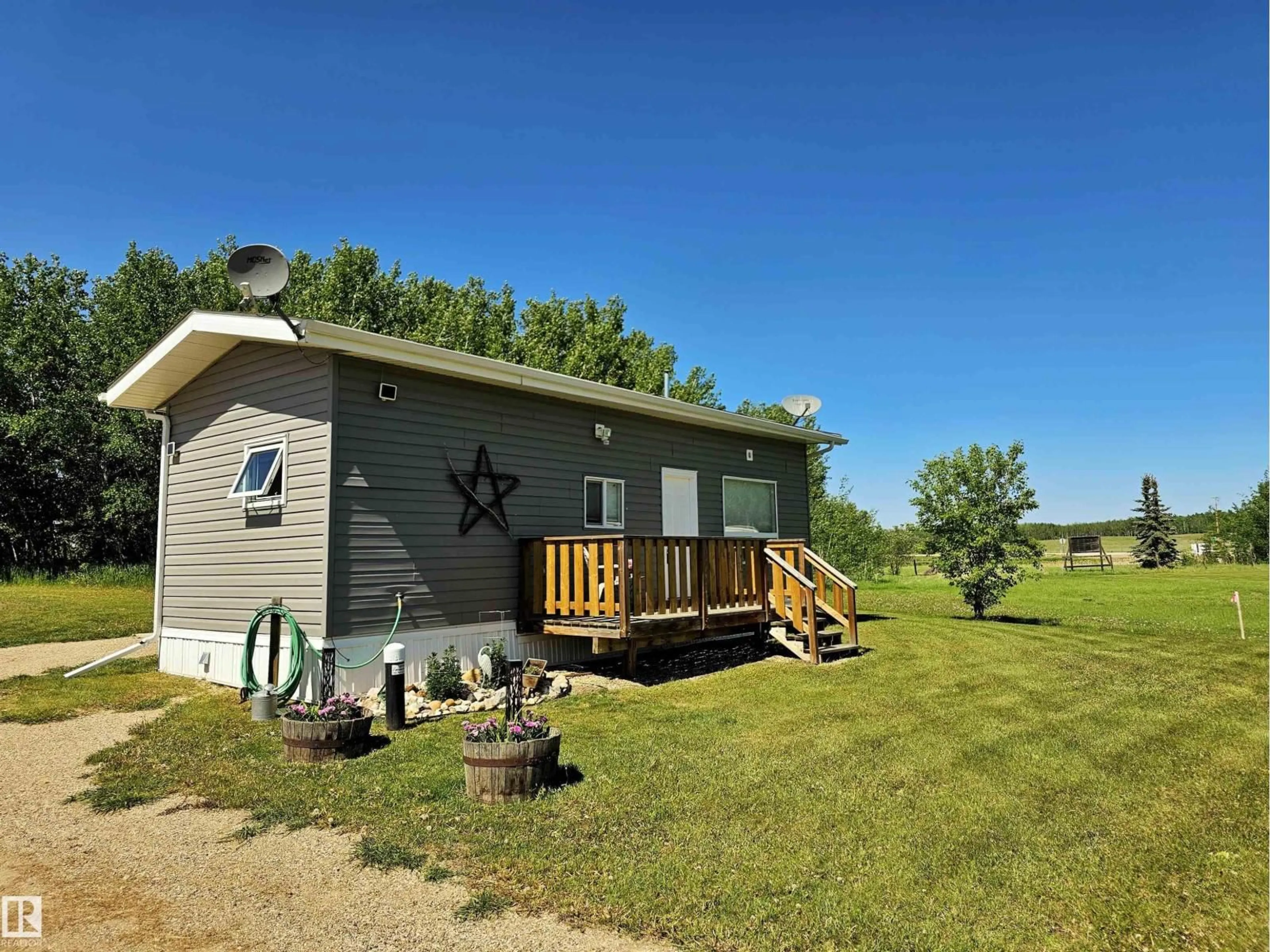 A pic from outside/outdoor area/front of a property/back of a property/a pic from drone, unknown for 106 - 57730 RANGE ROAD 30, Rural Barrhead County Alberta T0G0H0
