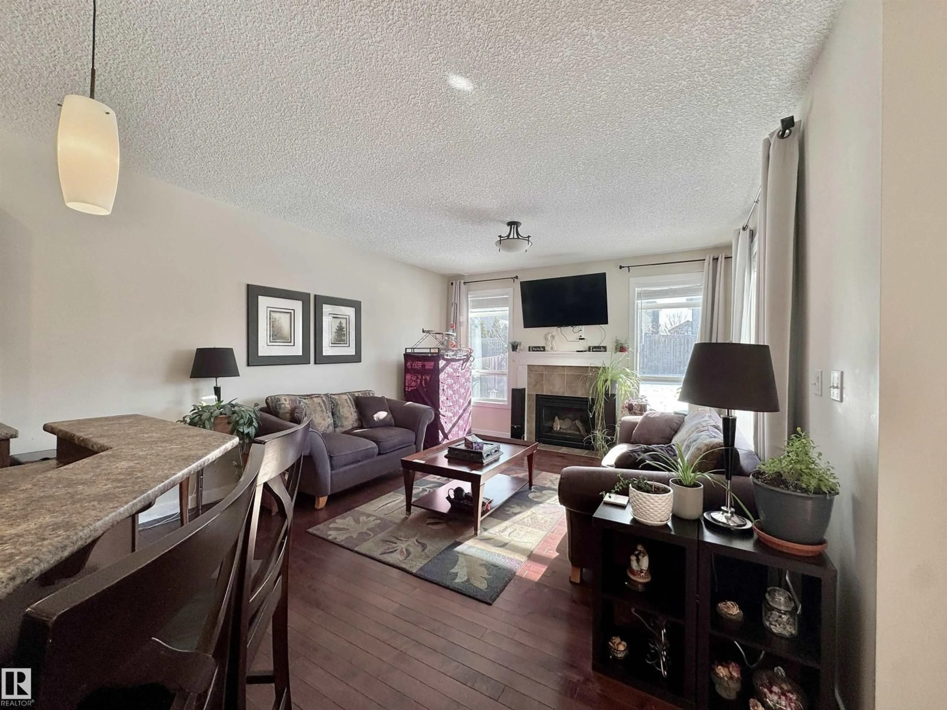Living room with furniture, wood/laminate floor for 29 HERON CR, Spruce Grove Alberta T7X0G1
