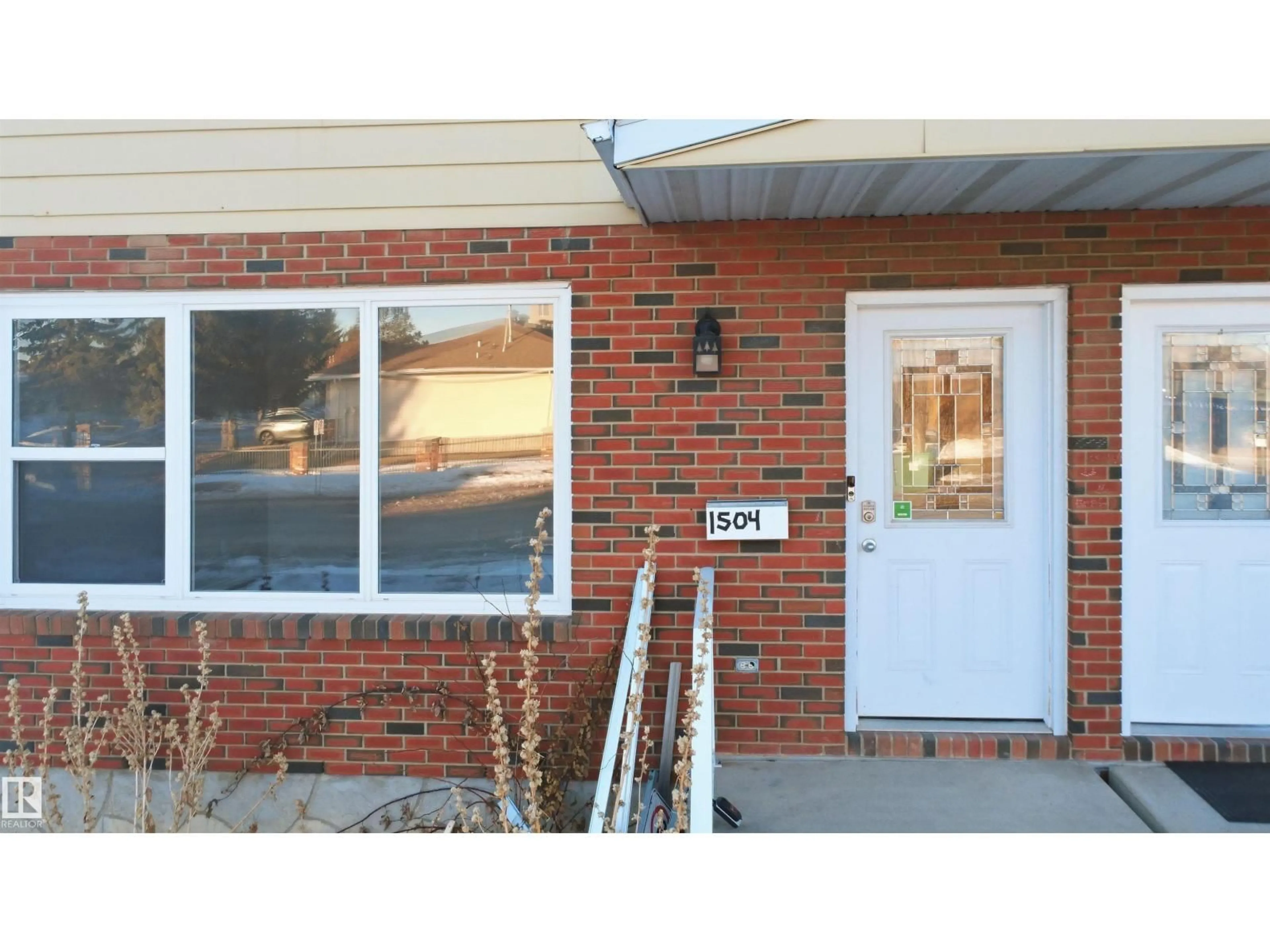 Home with brick exterior material, street for 1504 62 ST, Edmonton Alberta T6L1S8