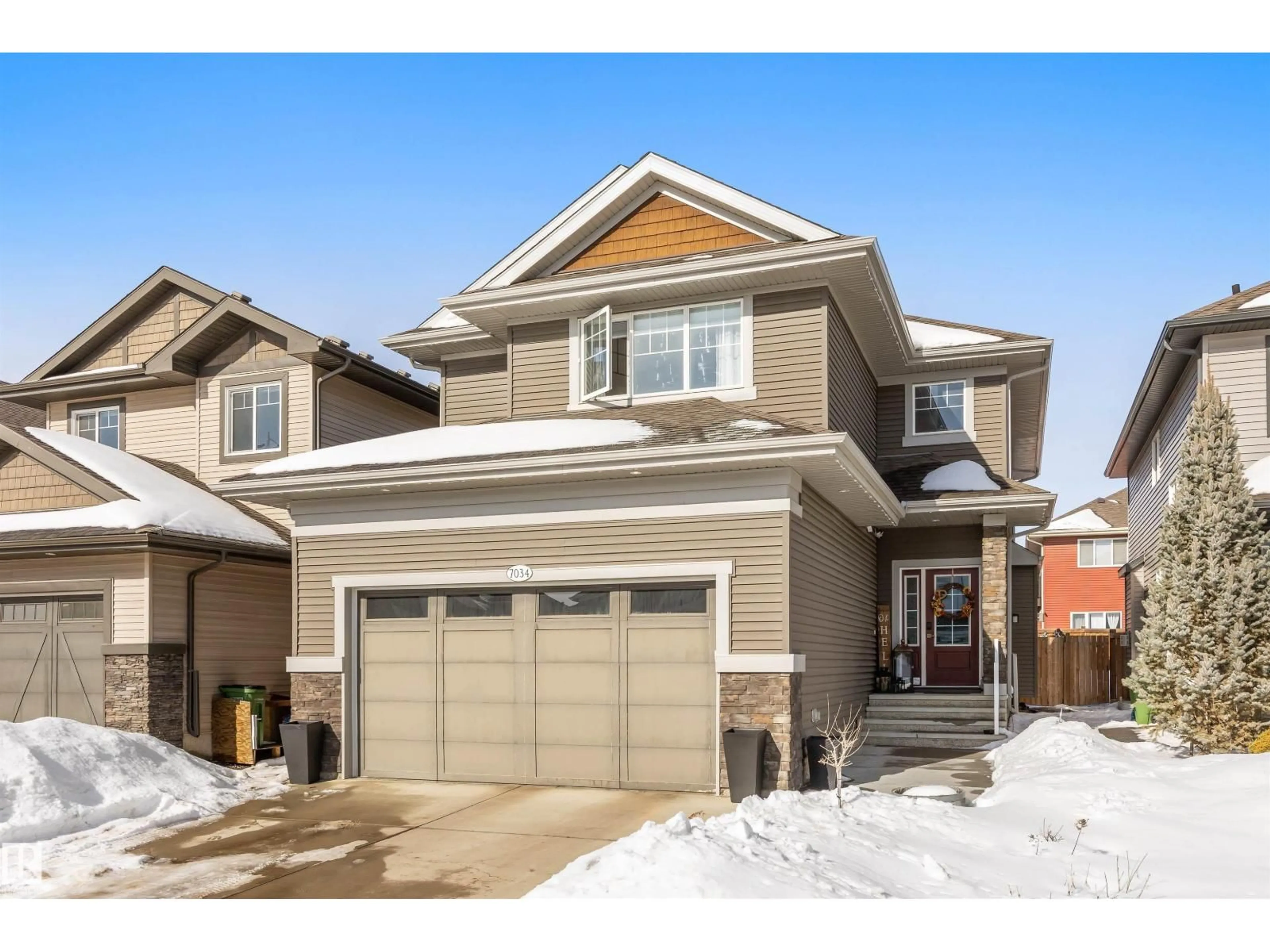 Home with vinyl exterior material, street for 7034 172A AV, Edmonton Alberta T5Z0M9