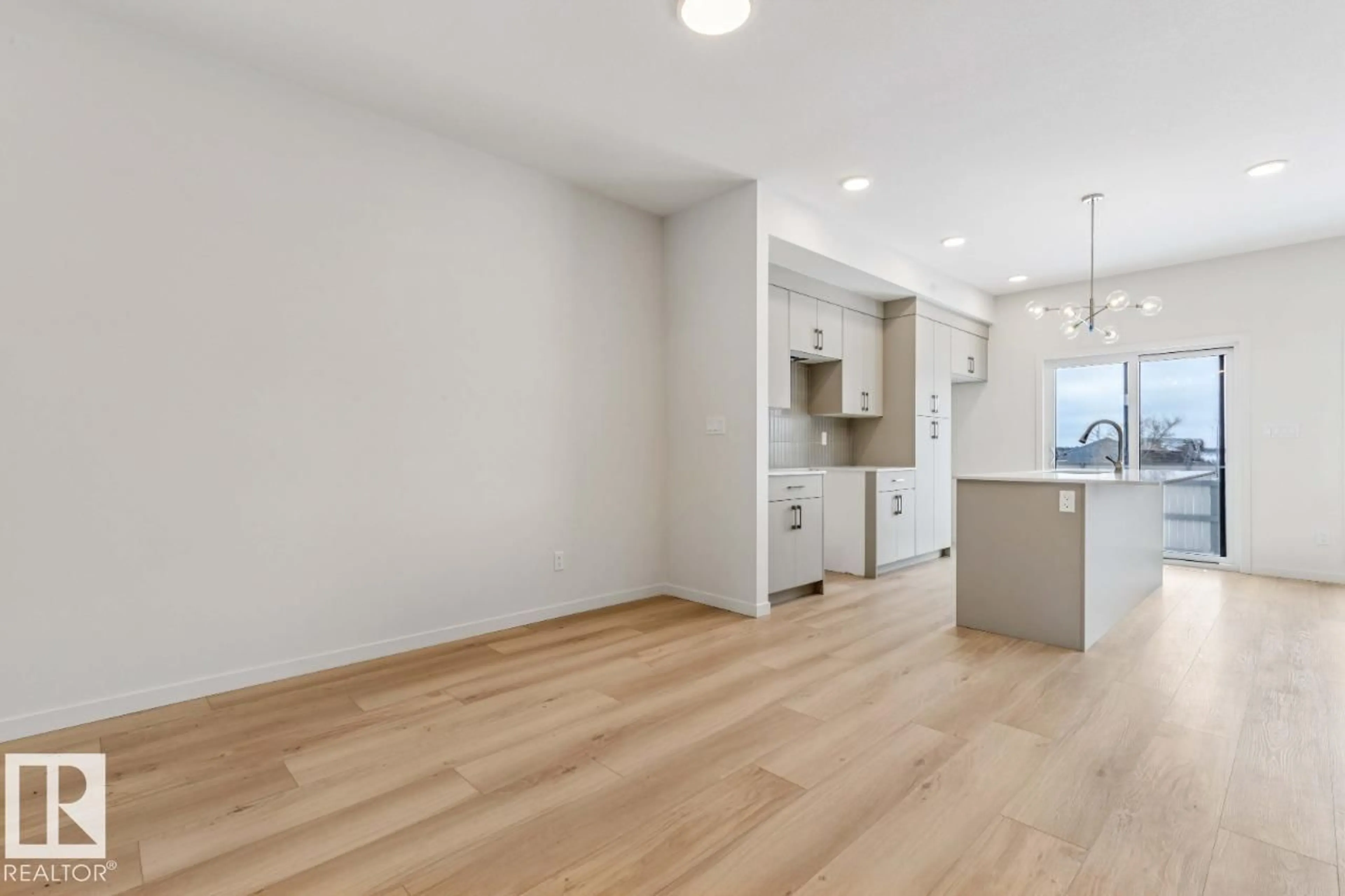 Open concept kitchen, wood/laminate floor for 25 STETSON LO, Ardrossan Alberta T8E0C1