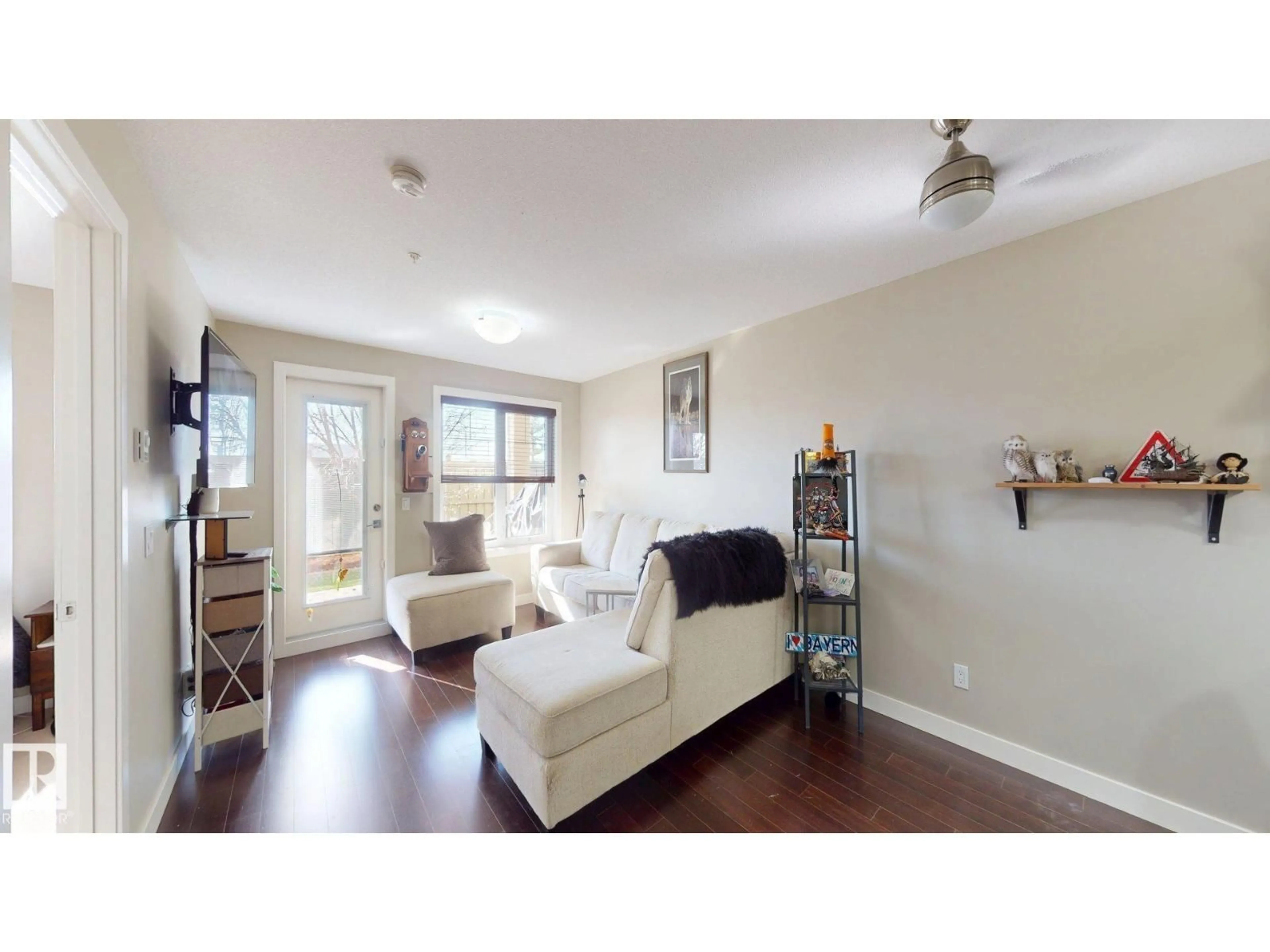 Living room with furniture, wood/laminate floor for 1031 - 109 173 ST, Edmonton Alberta T6W3E4