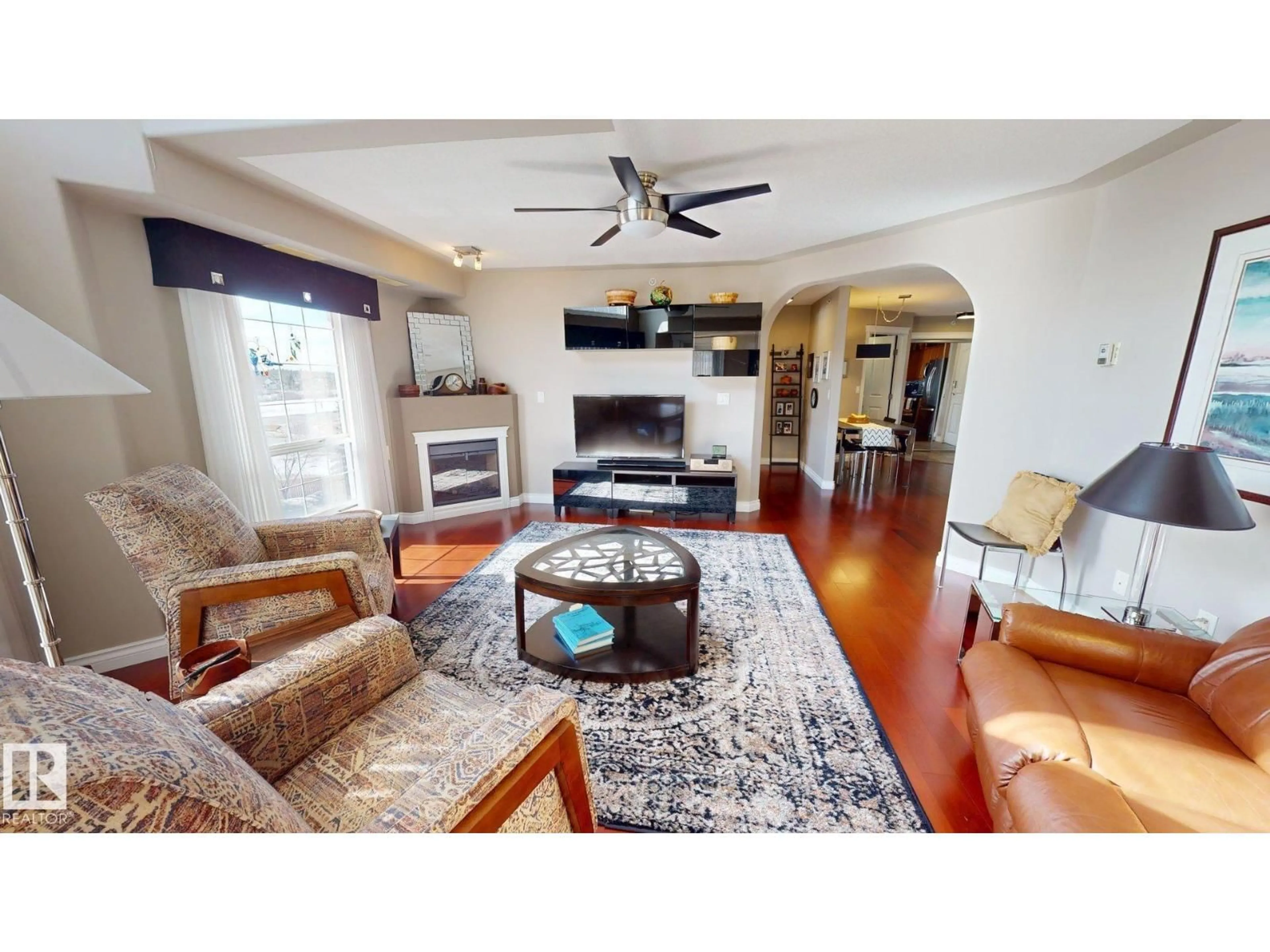 Living room with furniture, wood/laminate floor for #428 - 7801 GOLF COURSE RD, Stony Plain Alberta T7Z0C7