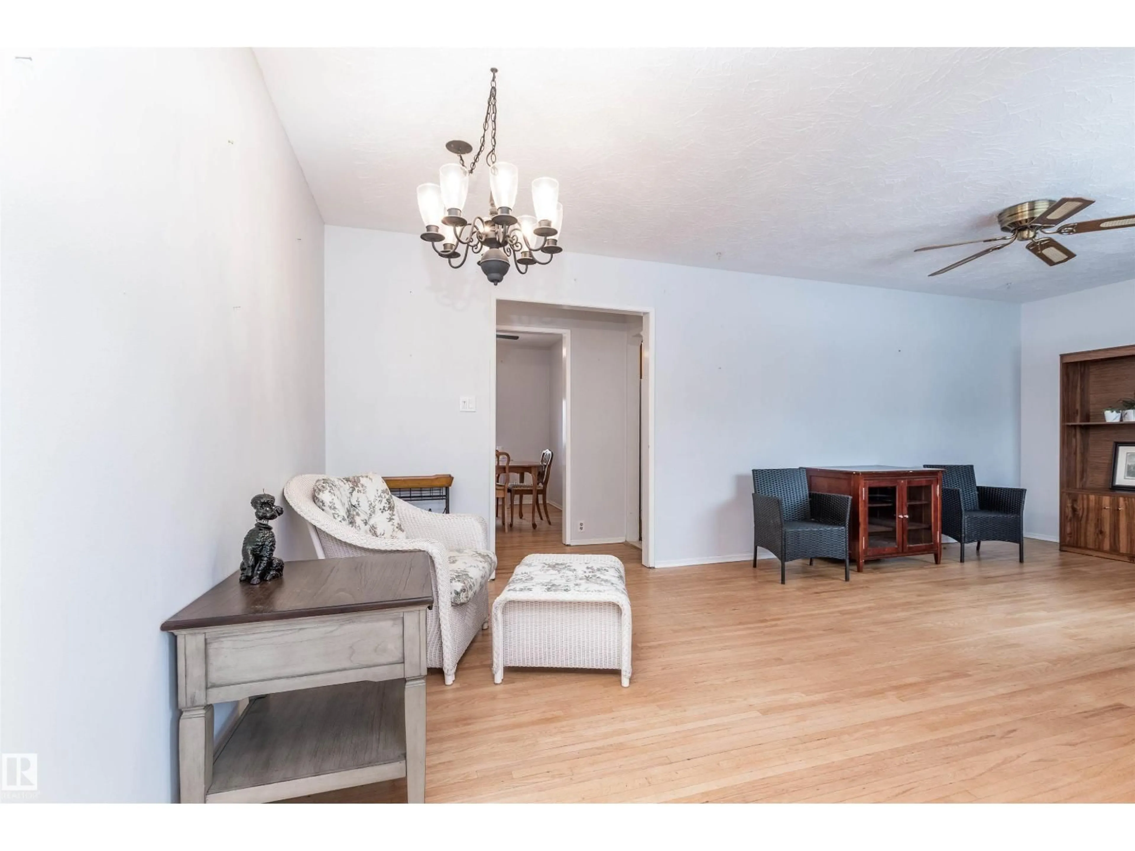 Living room with furniture, wood/laminate floor for 13512 124A AV, Edmonton Alberta T5L3B5
