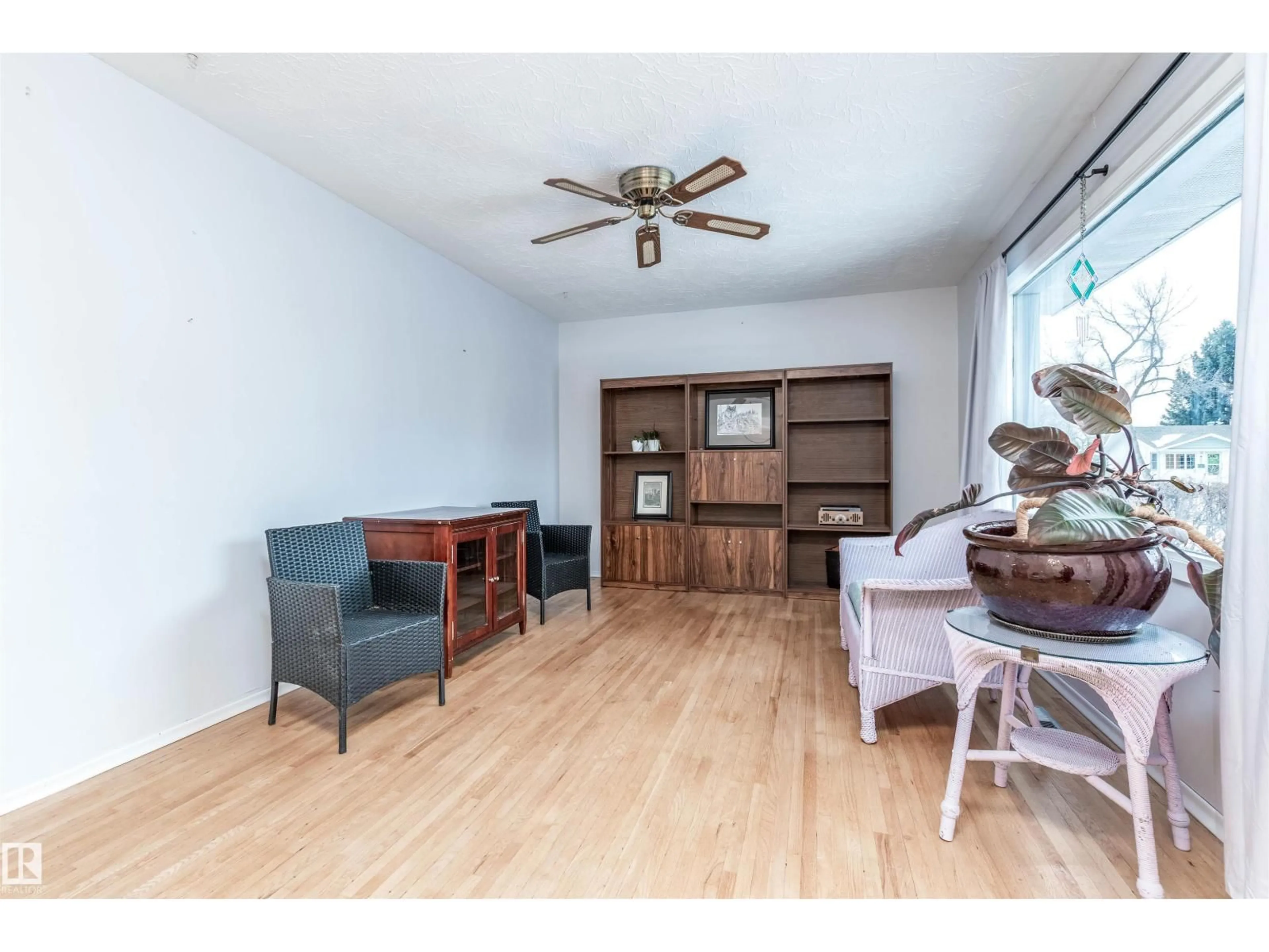 Living room with furniture, wood/laminate floor for 13512 124A AV, Edmonton Alberta T5L3B5
