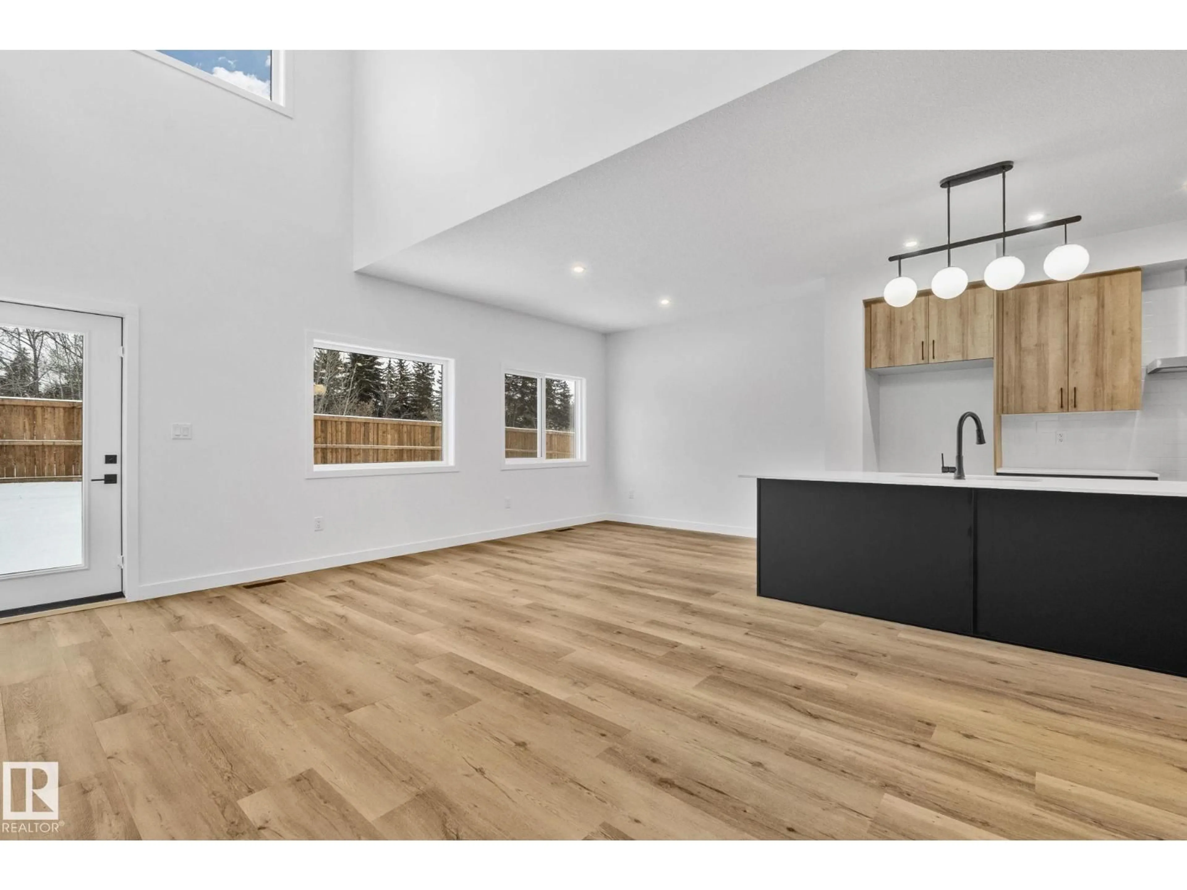 Open concept kitchen, wood/laminate floor for 114 ROYAL STREET, St. Albert Alberta T8N7X4
