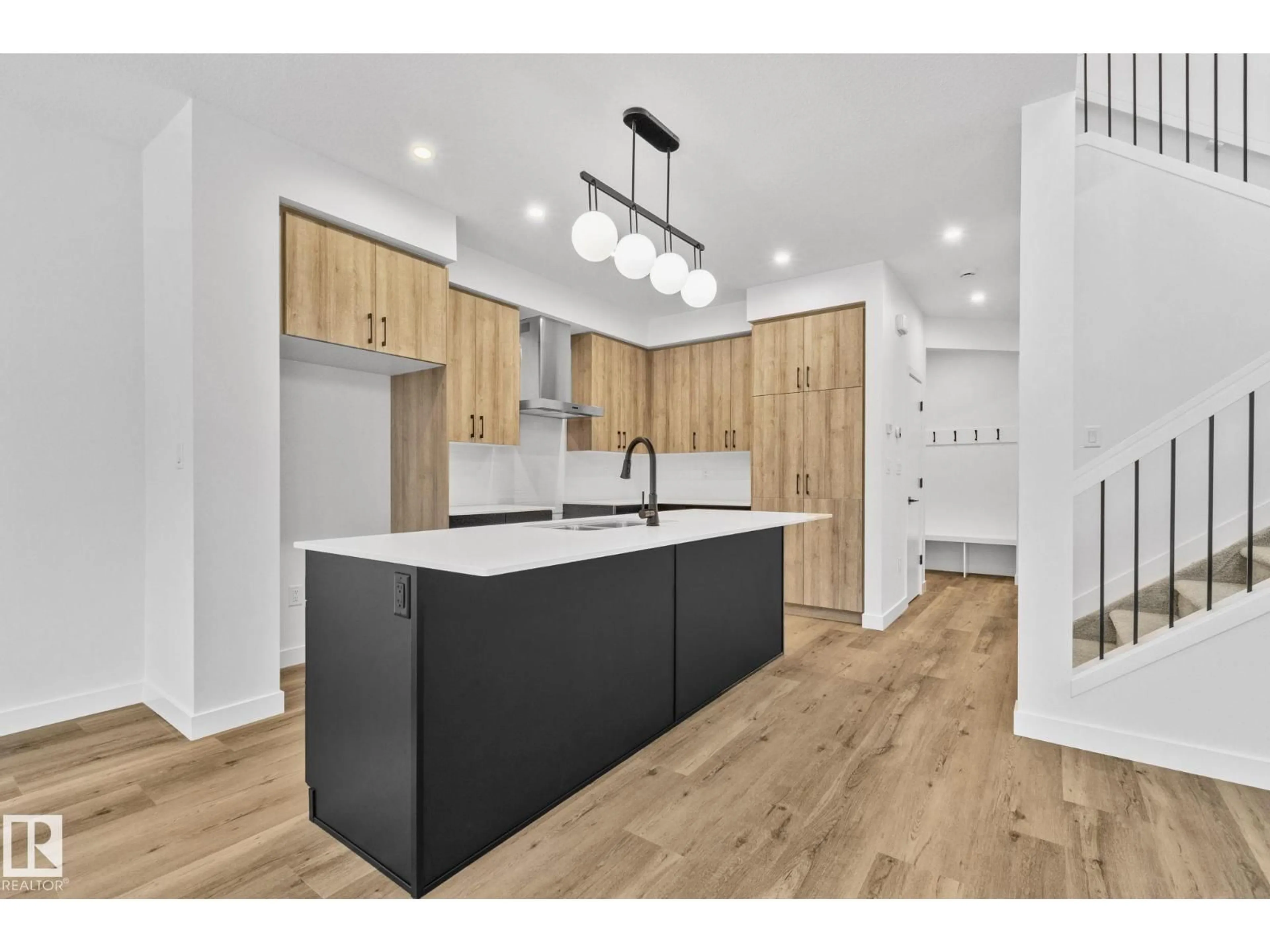 Open concept kitchen, wood/laminate floor for 114 ROYAL STREET, St. Albert Alberta T8N7X4