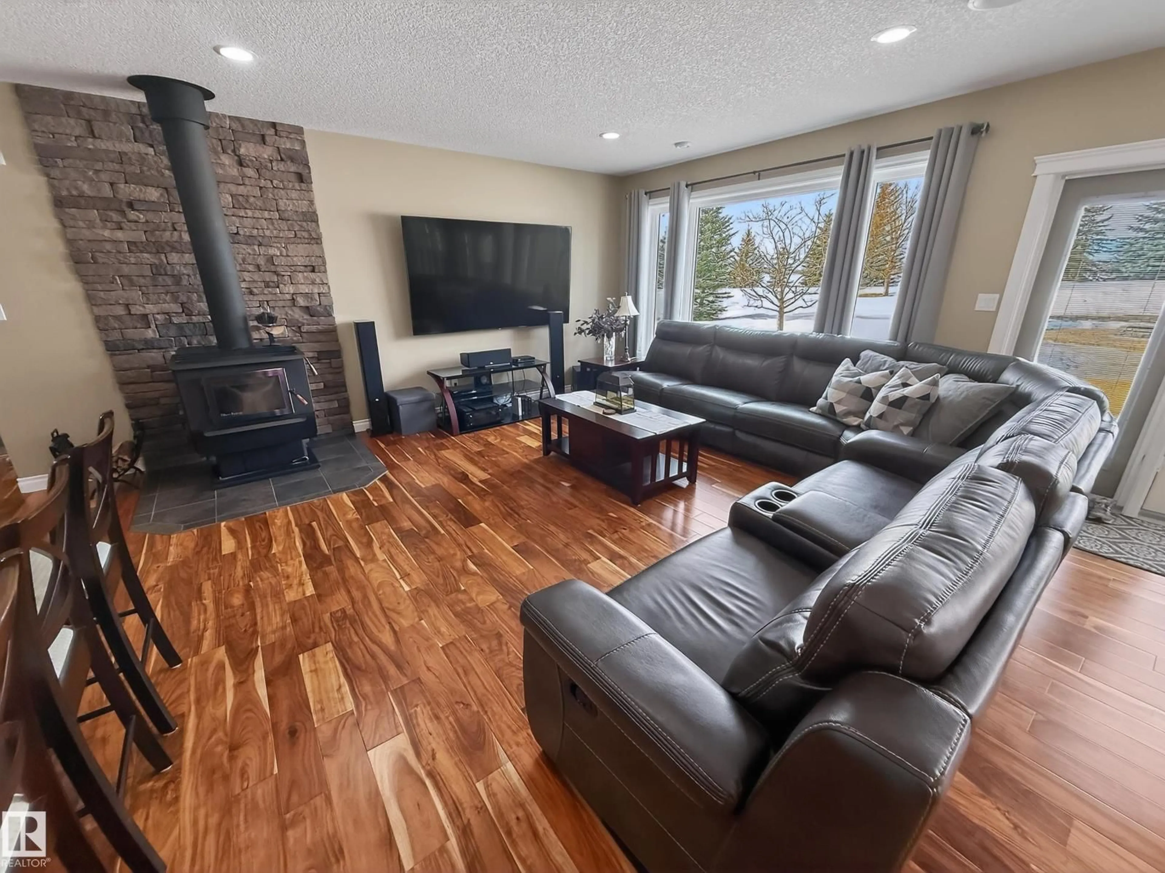 Living room with furniture, wood/laminate floor for 51016 RGE ROAD 270, Rural Parkland County Alberta T7Y1G8