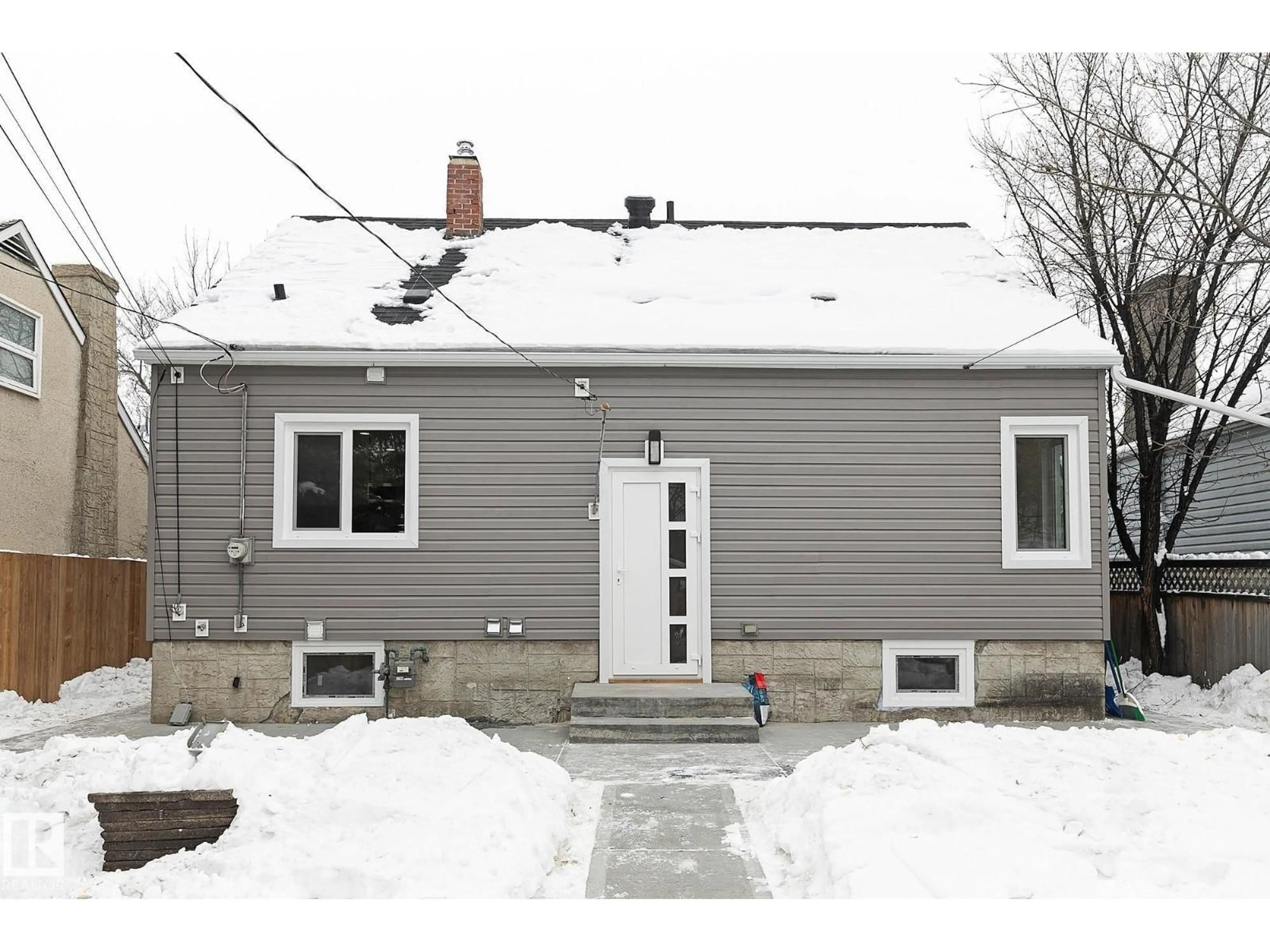 Home with vinyl exterior material, street for NW - 11306 105 ST, Edmonton Alberta T5G2M6