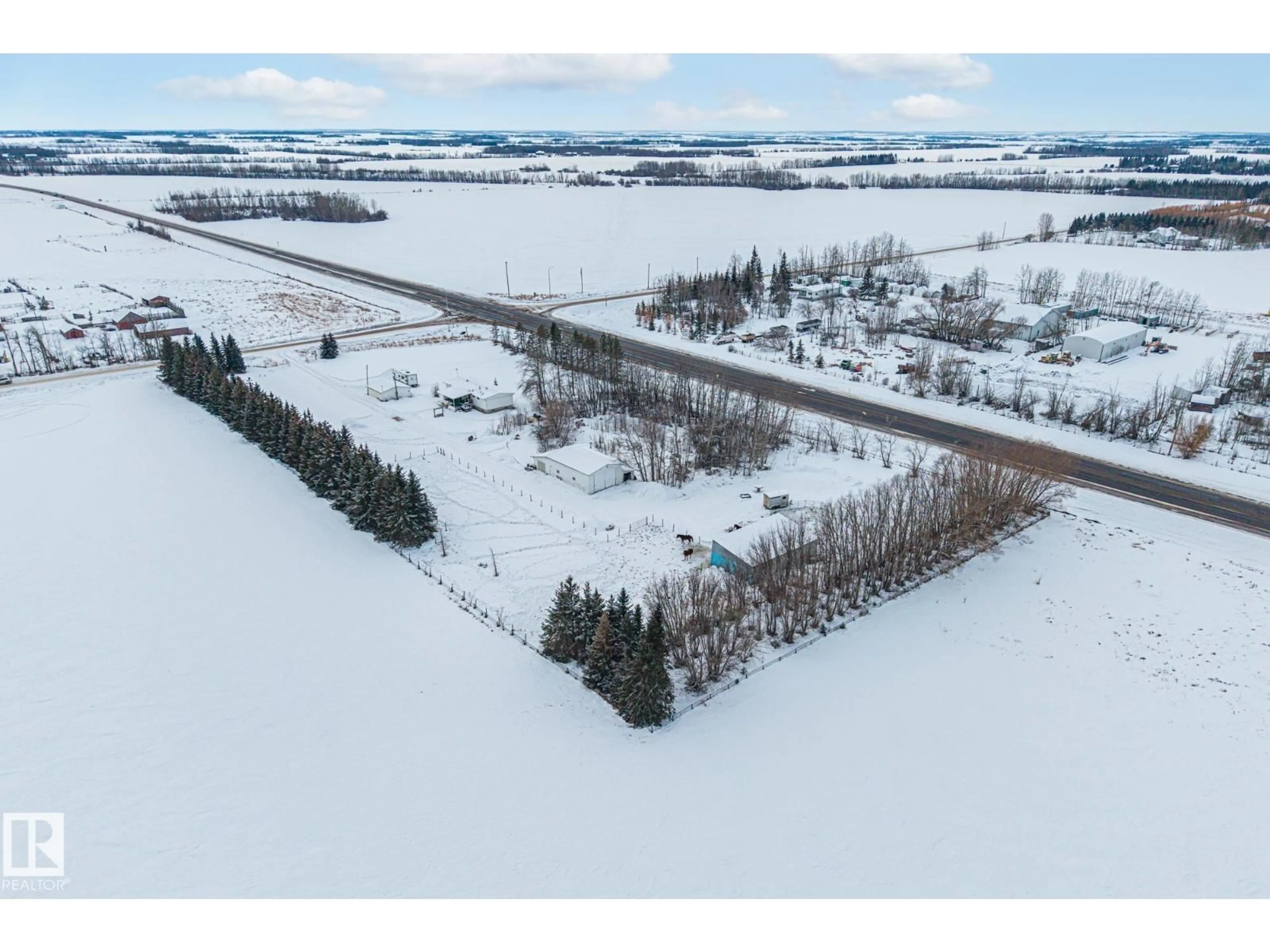 A pic from outside/outdoor area/front of a property/back of a property/a pic from drone, unknown for 26332 TWP ROAD 594, Rural Westlock County Alberta T7P2P5
