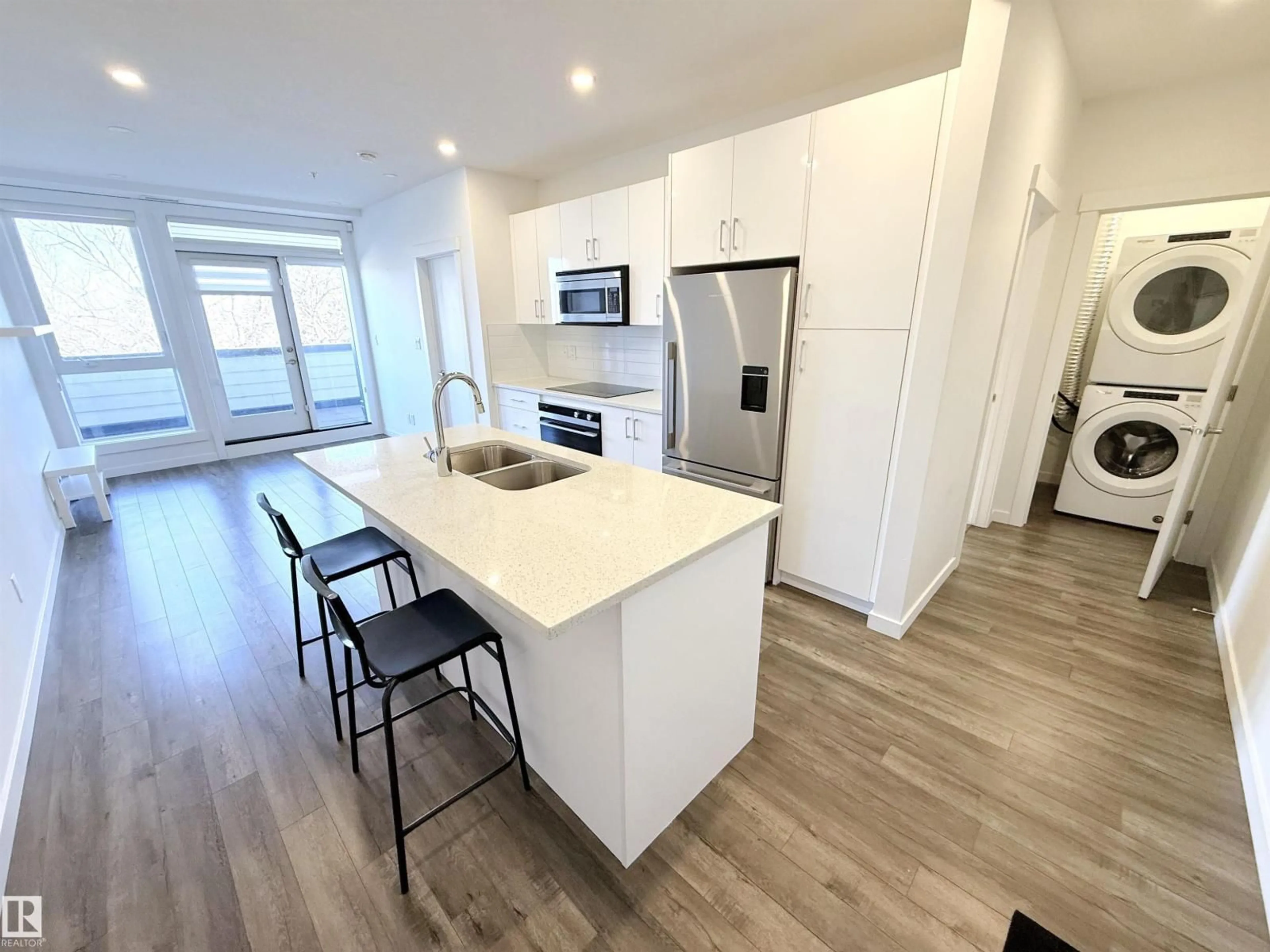 Open concept kitchen, wood/laminate floor for #405 - 11503 76 AV, Edmonton Alberta T6G0K6