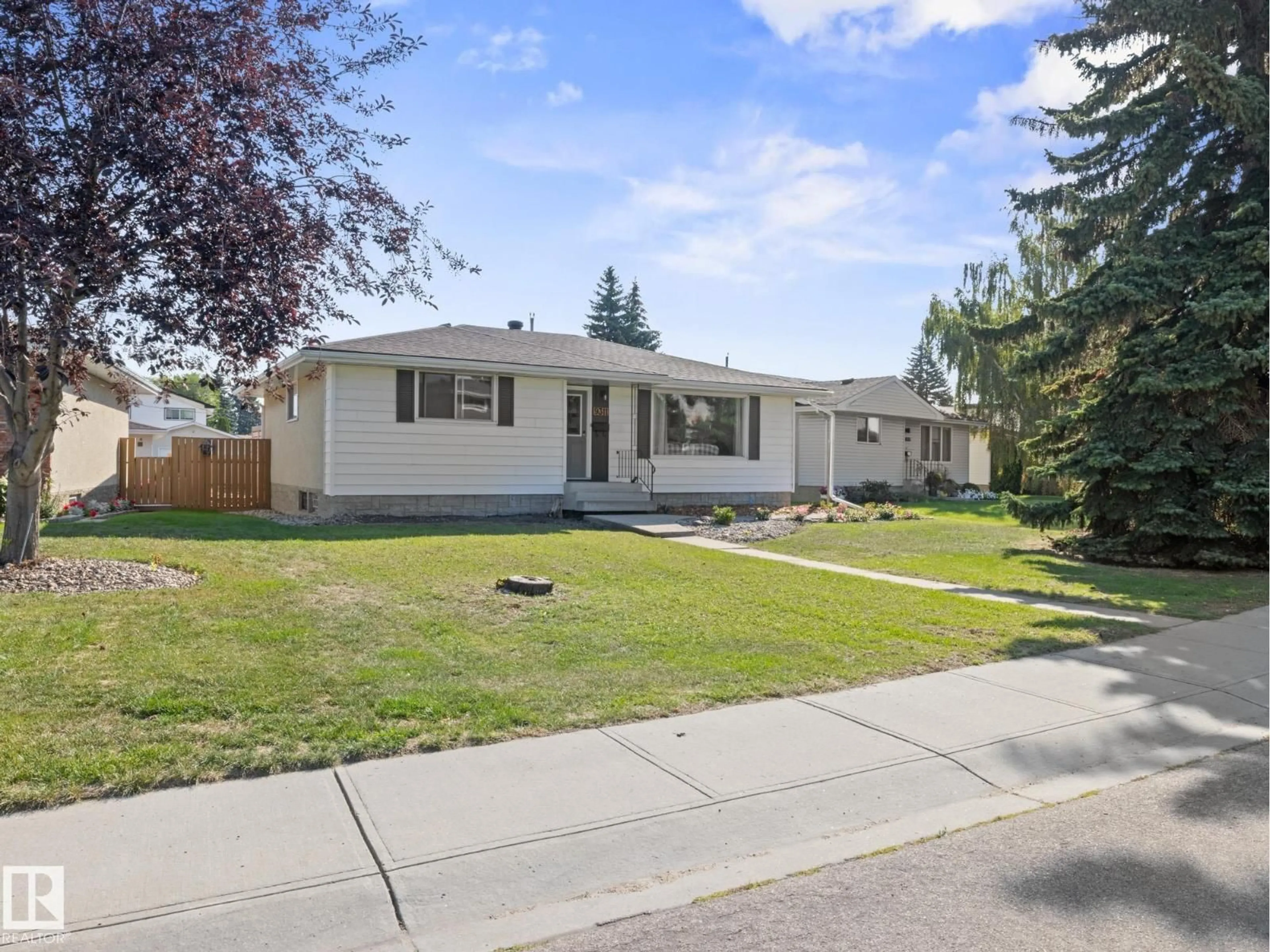 Home with vinyl exterior material, street for NW - 9311 169 ST, Edmonton Alberta T5R2X4