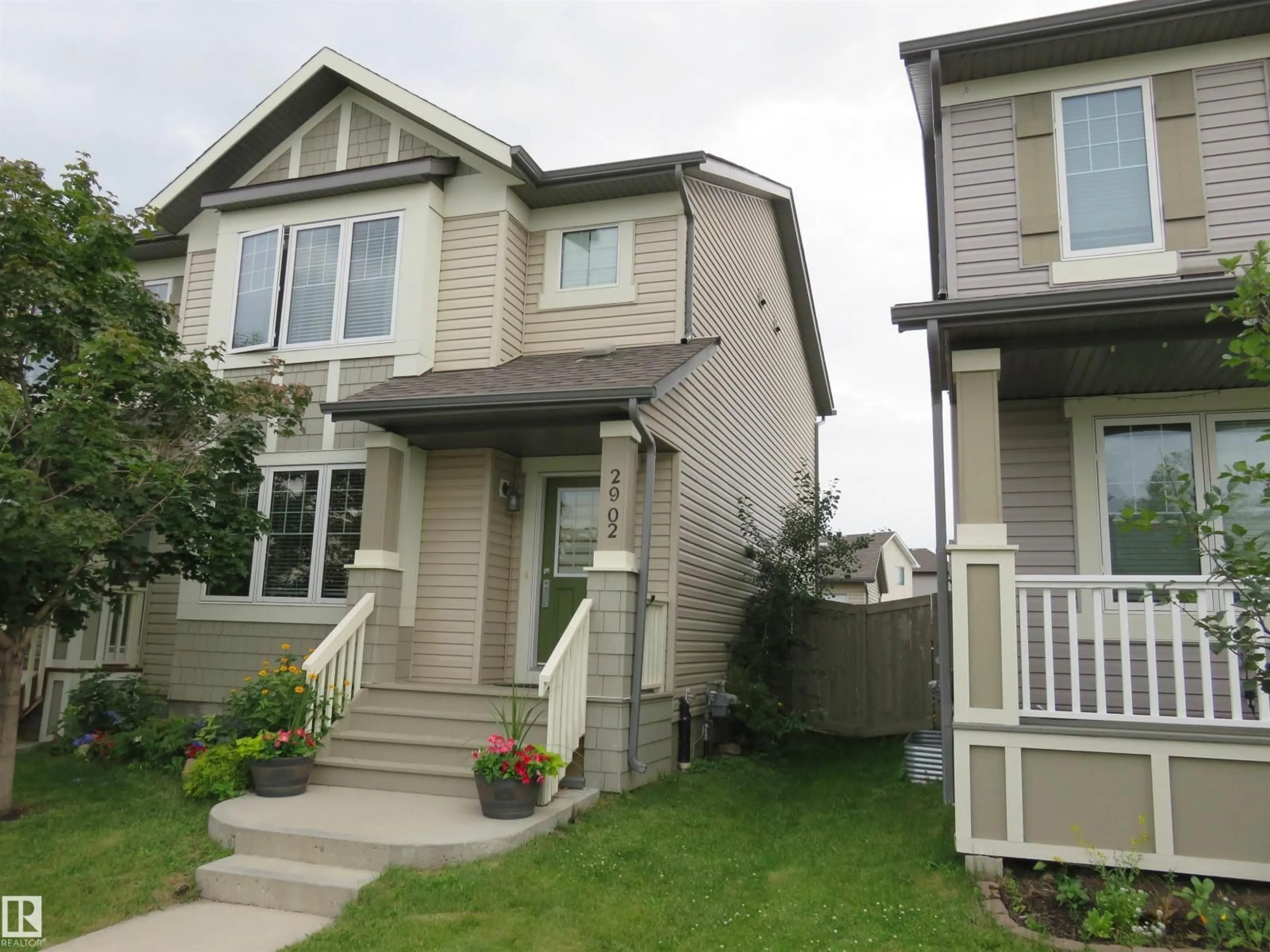 Home with vinyl exterior material, street for 2902 MAPLE WY, Edmonton Alberta T6T0T4