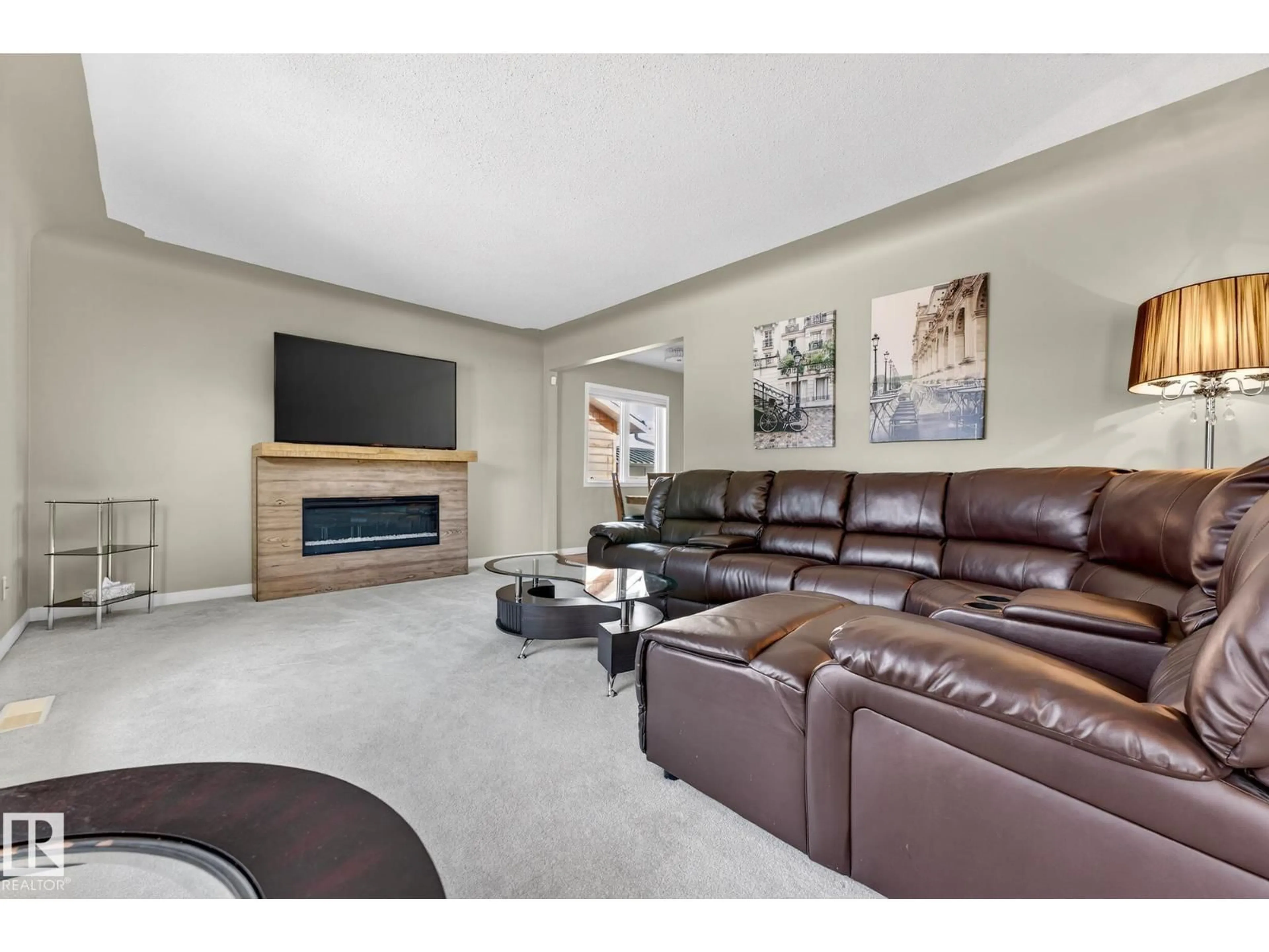 Living room with furniture, ceramic/tile floor for 10583 40 ST, Edmonton Alberta T6A1S9