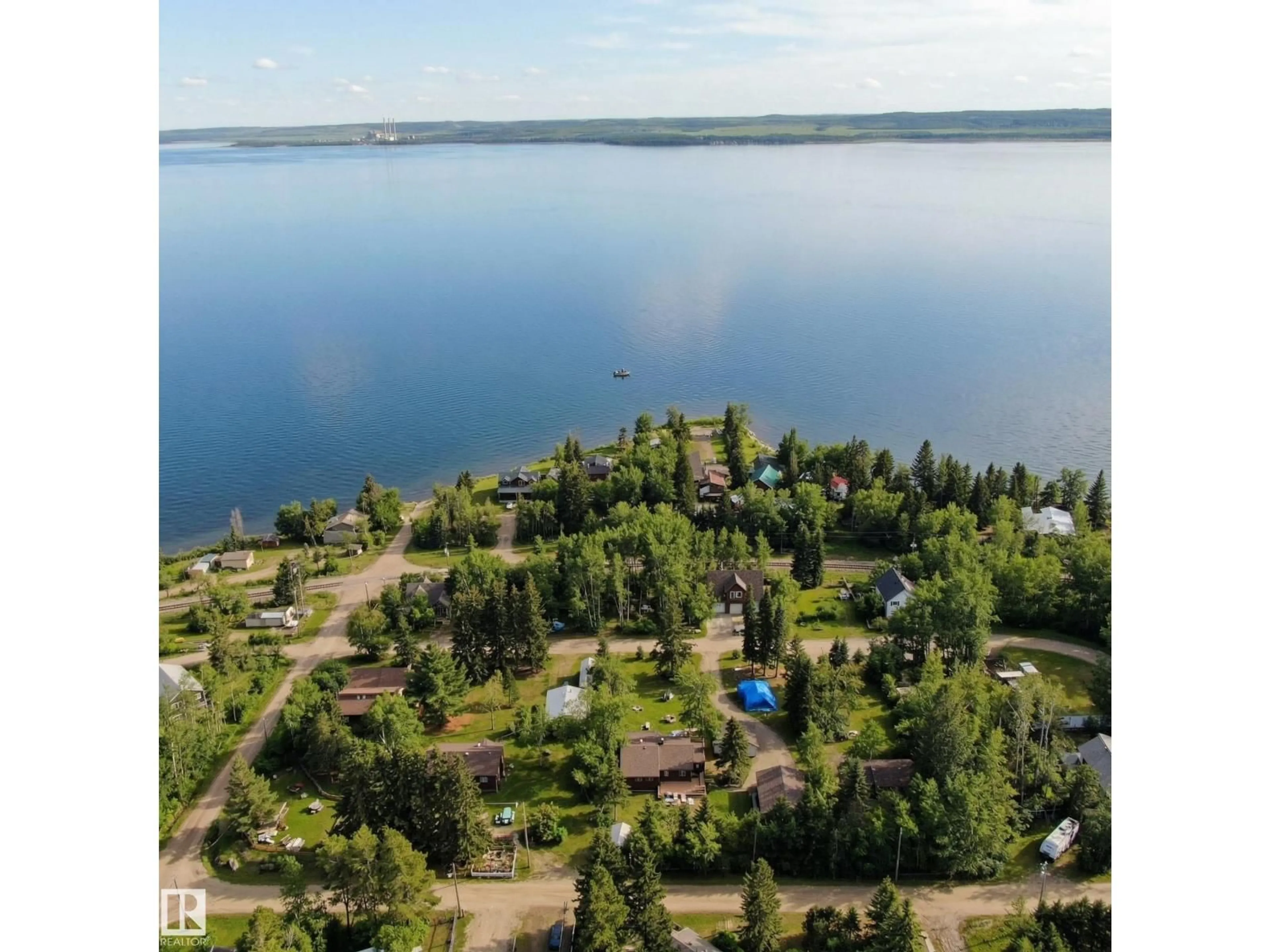 A pic from outside/outdoor area/front of a property/back of a property/a pic from drone, water/lake/river/ocean view for 4521 - 128 LAKESHORE RD, Rural Parkland County Alberta T0E2K0
