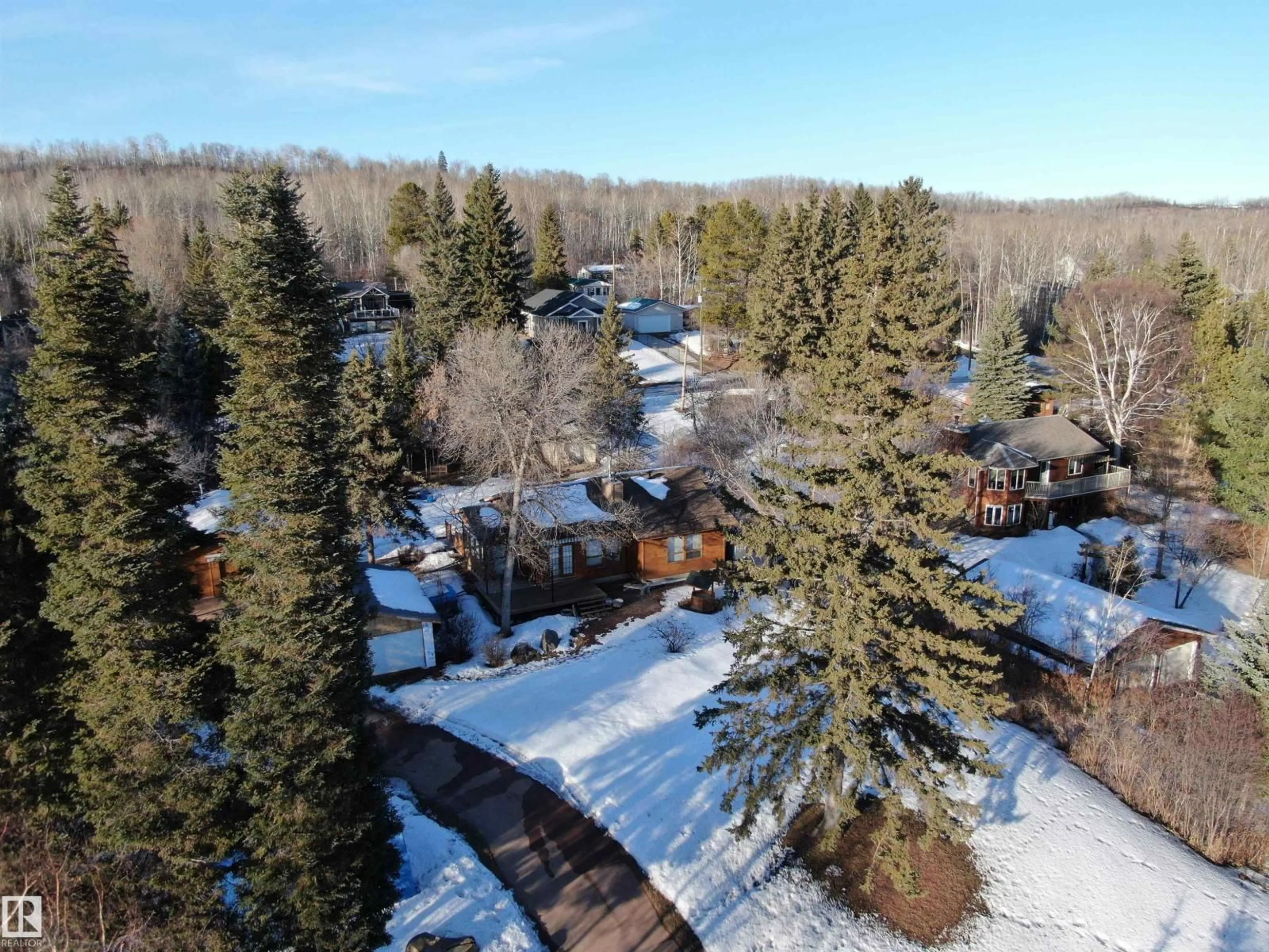 A pic from outside/outdoor area/front of a property/back of a property/a pic from drone, forest/trees view for 4521 - 128 LAKESHORE RD, Rural Parkland County Alberta T0E2K0