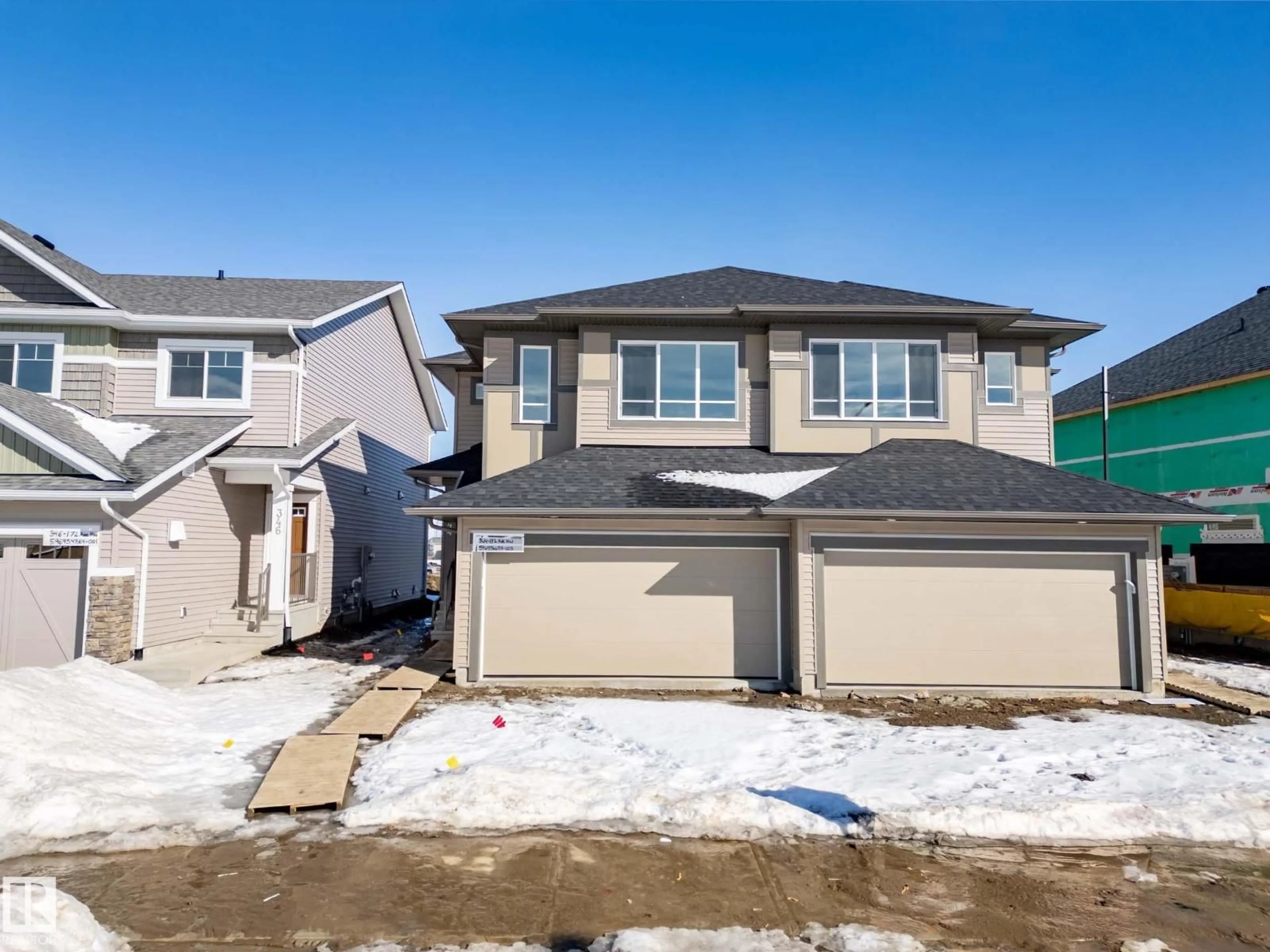 Home with vinyl exterior material, street for 344 172 AV, Edmonton Alberta T5Y4K9
