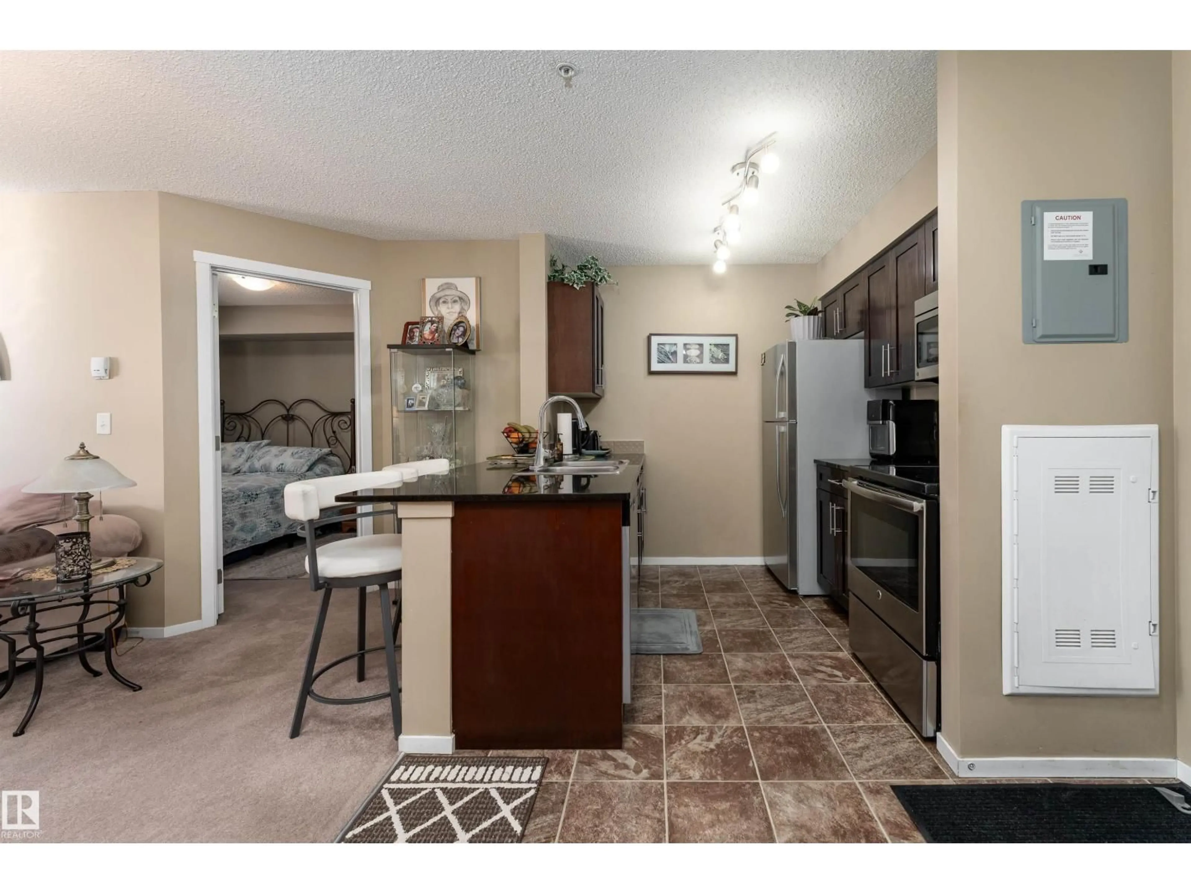 Open concept kitchen, ceramic/tile floor for #111 - 5370 CHAPPELLE RD, Edmonton Alberta T6W3L5