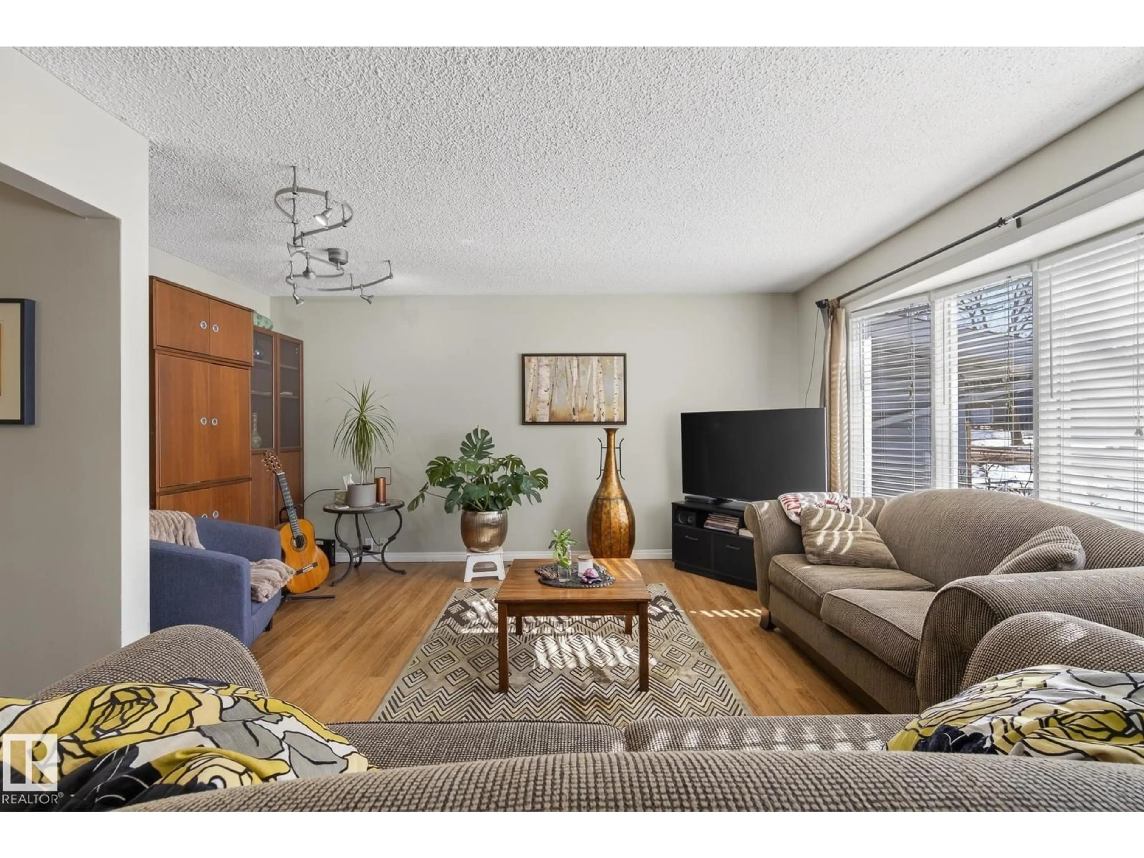 Living room with furniture, wood/laminate floor for 951 BIRCH AV, Sherwood Park Alberta T8A1X6