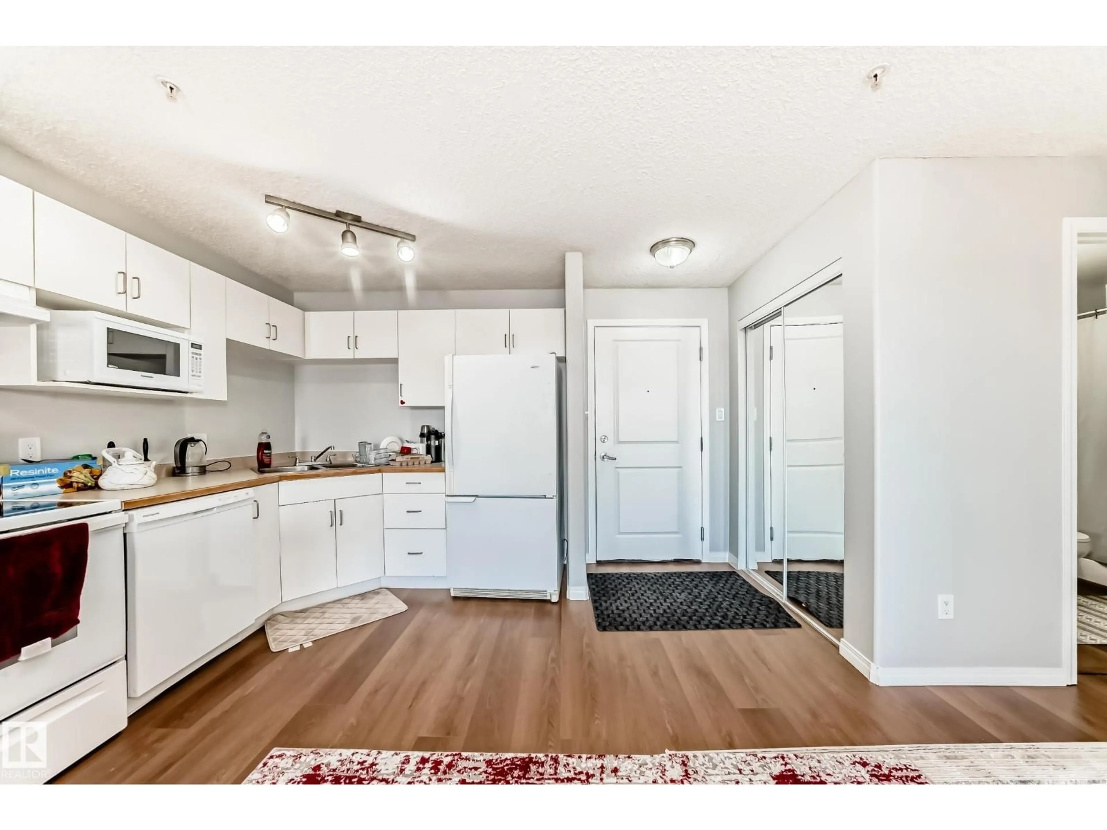 Open concept kitchen, wood/laminate floor for 427 11325 83 ST NW, Edmonton Alberta T5B4W5