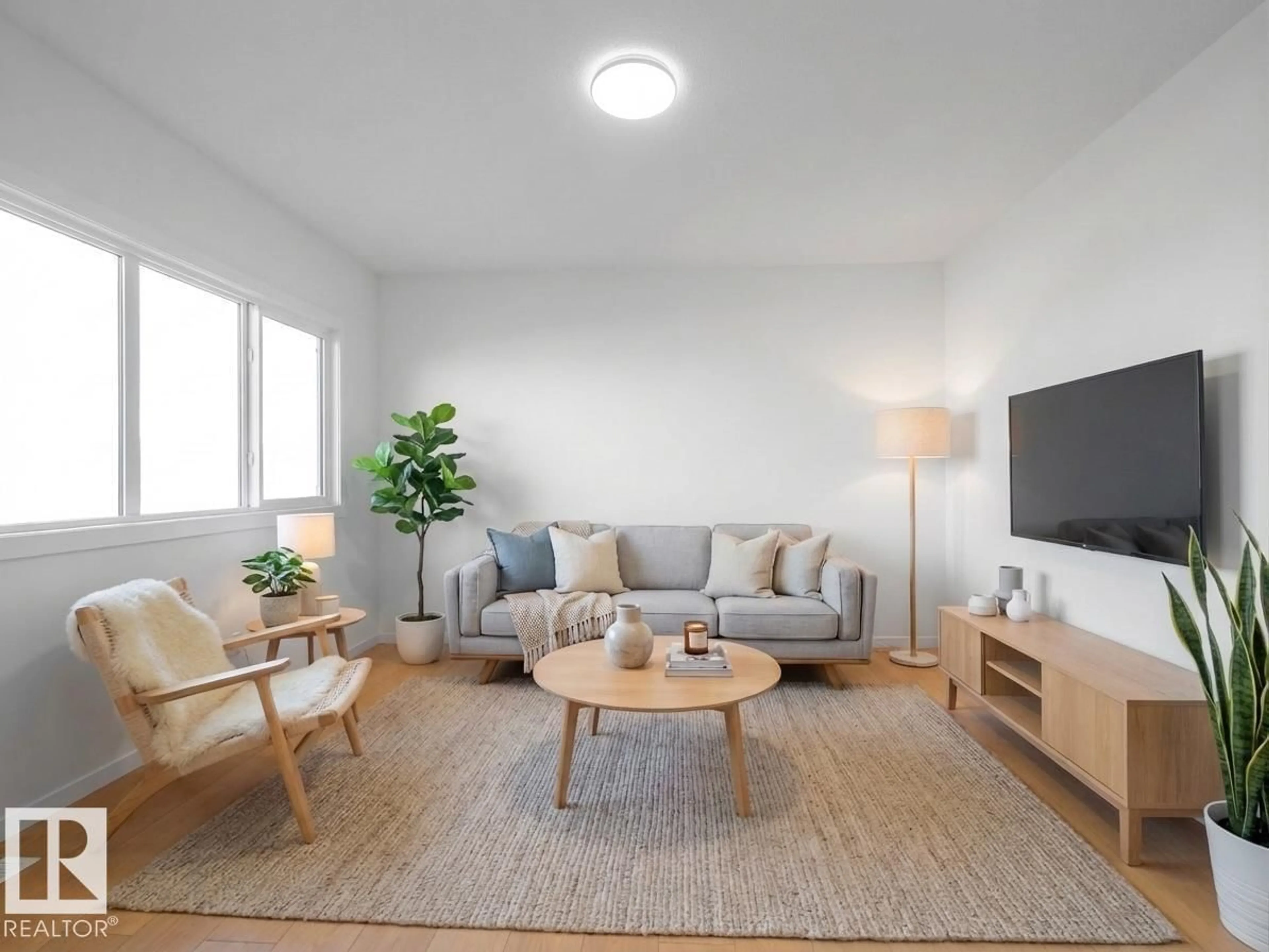 Living room with furniture, wood/laminate floor for 19418 22A AV, Edmonton Alberta T6M3J2