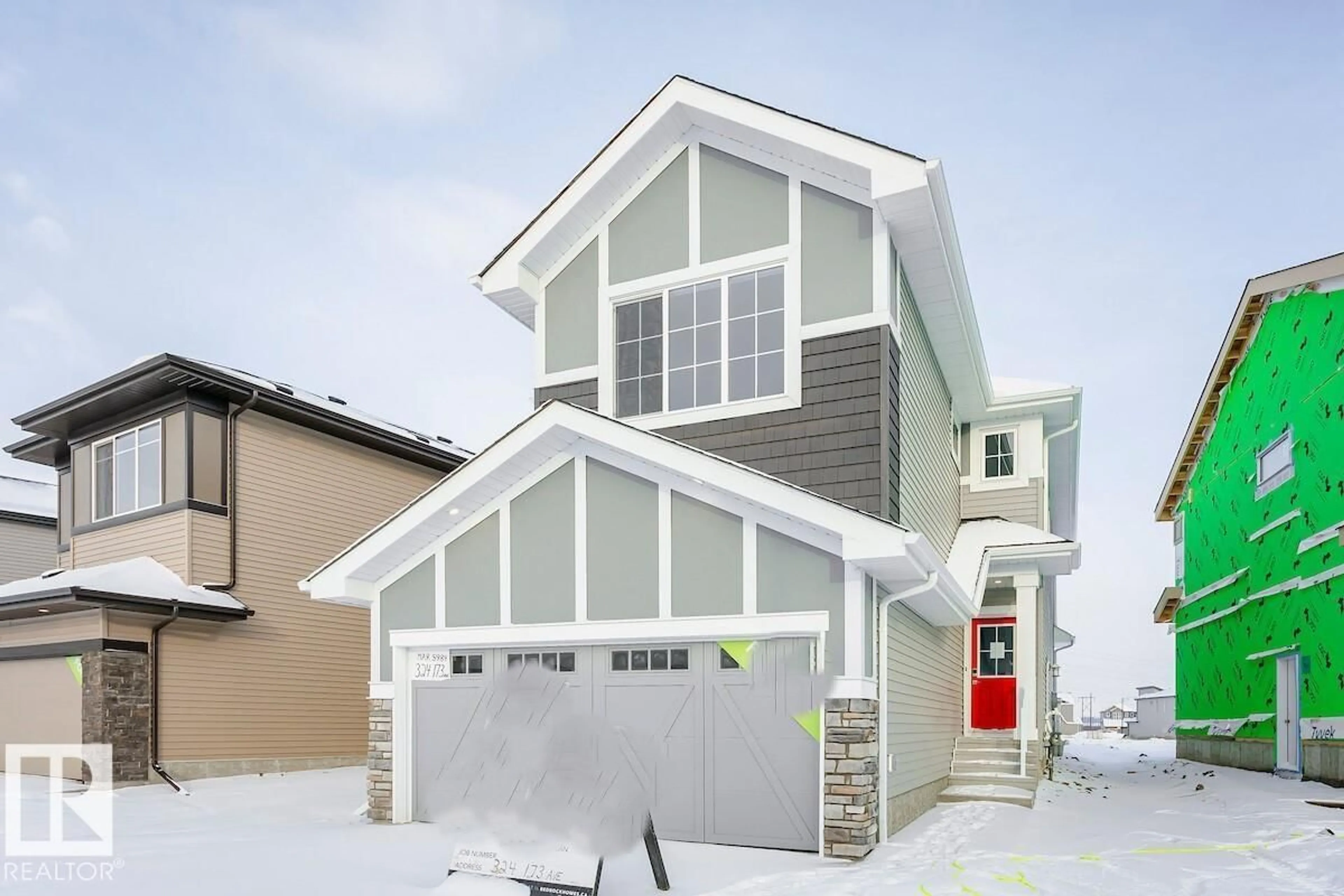 Home with vinyl exterior material, street for 324 173 AV, Edmonton Alberta T5Y4G6