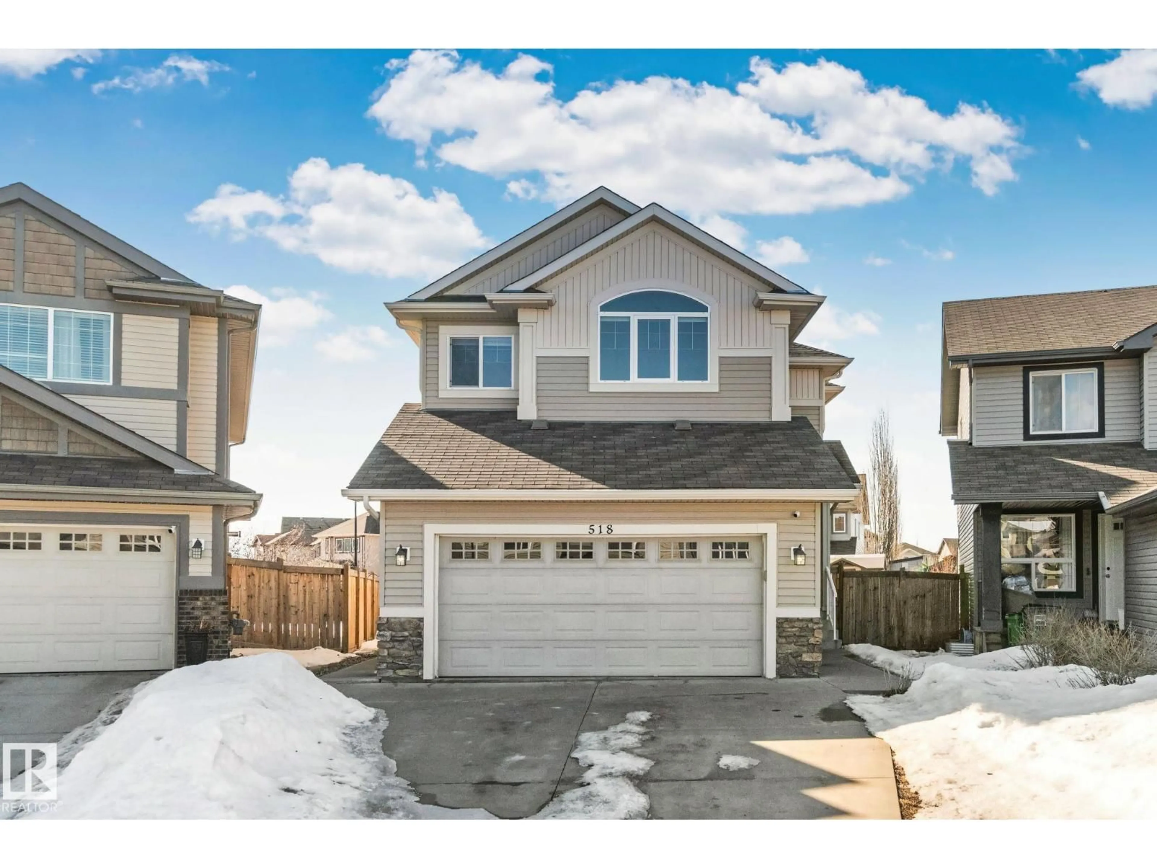 Home with vinyl exterior material, street for 518 173A STREET SW, Edmonton Alberta T6W2A5