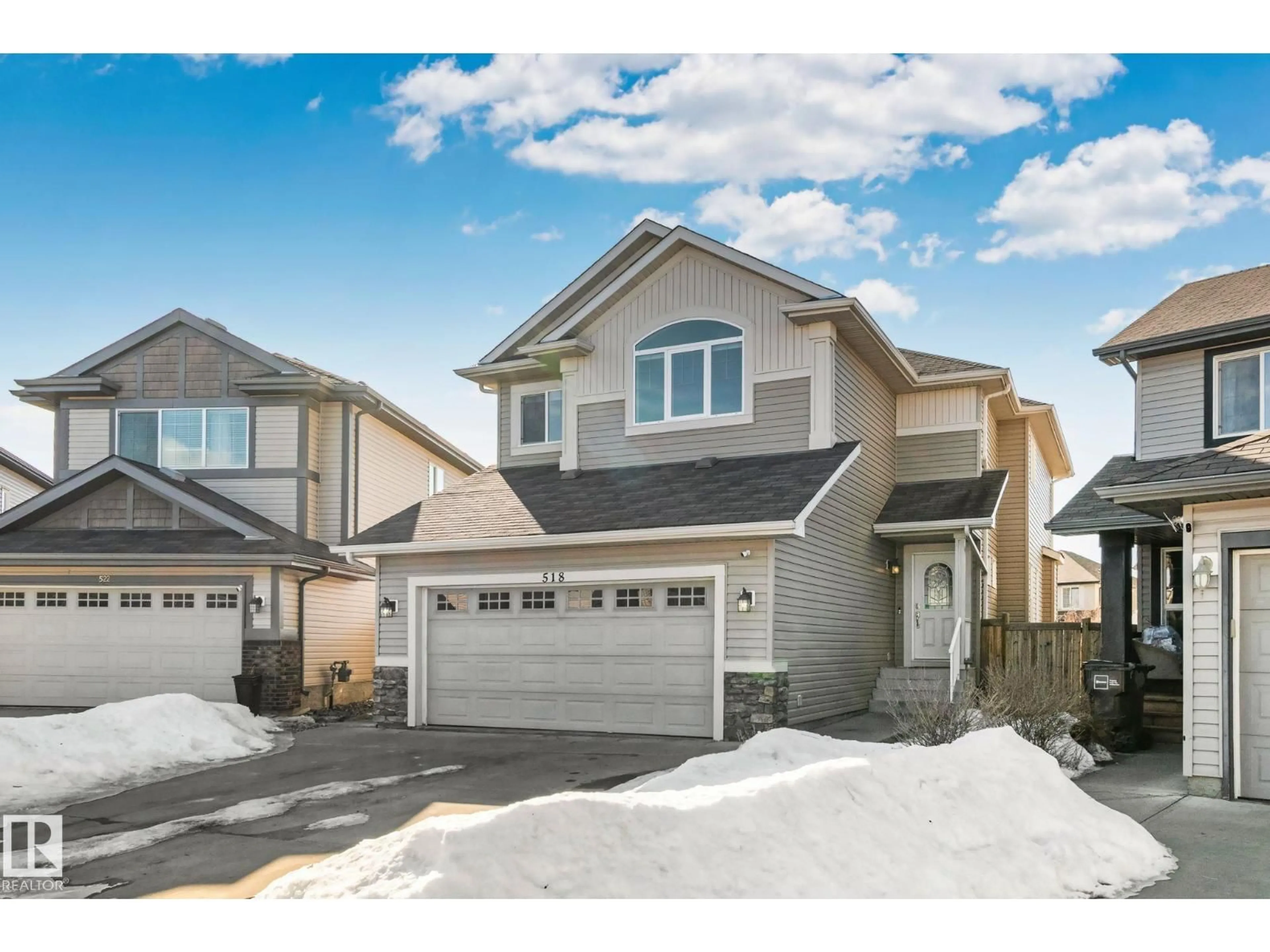 Home with vinyl exterior material, street for 518 173A STREET SW, Edmonton Alberta T6W2A5