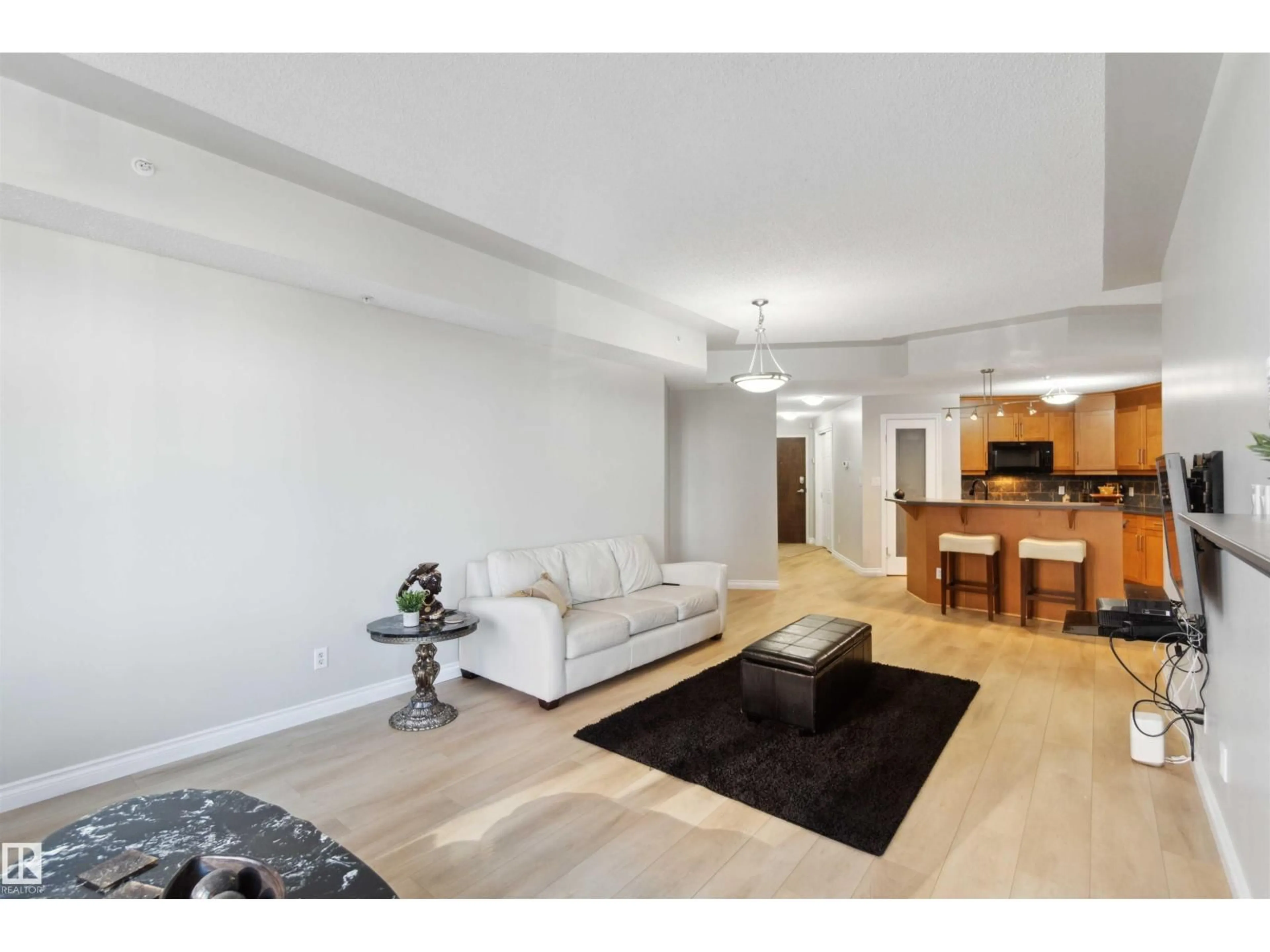 Living room with furniture, unknown for #402 - 9020 JASPER AV, Edmonton Alberta T5H3S8