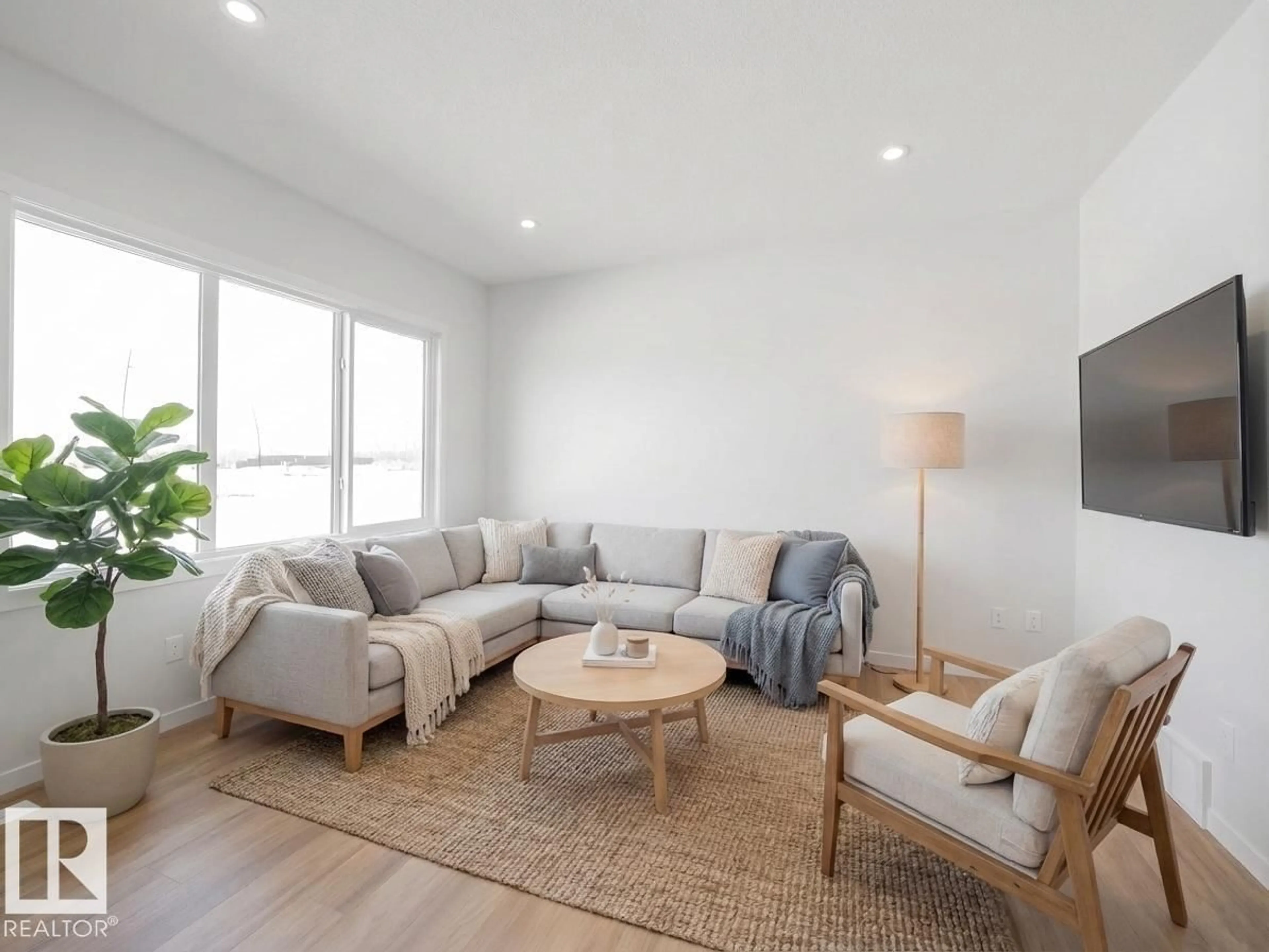 Living room with furniture, wood/laminate floor for NW - 2524 211 ST, Edmonton Alberta T6M3H1